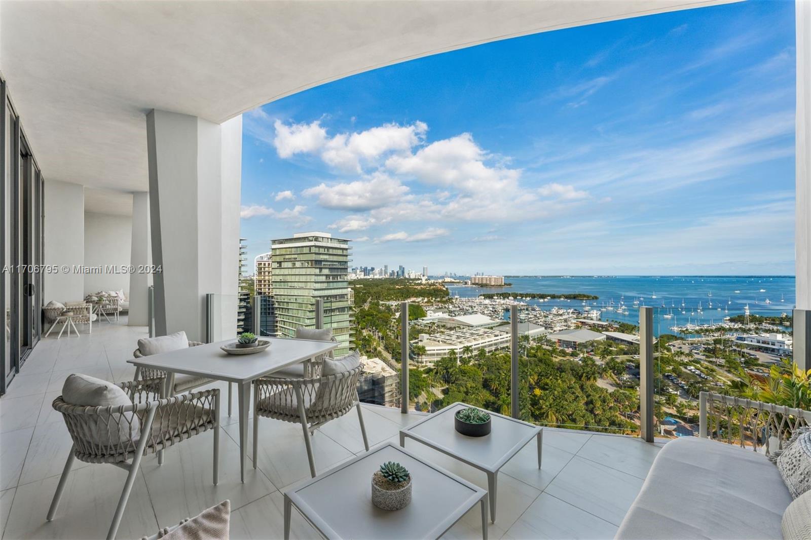 Extraordinary 4-BD, 4.5-BA combined unit in the highly sought-after One Park Grove in Coconut Grove. The residence showcases 3,365 SF of luxurious living with endless bay views. Boasting top-of-the-line finishes, every detail has been meticulously curated and expertly designed by renowned designer Deborah Wecselman to offer unparalleled quality and style. The sizable living and family rooms are adorned with elegant wood slat wall paneling and integrated lighting, creating the perfect ambiance for entertaining. A gourmet eat-in kitchen offers ample counter space, high-end cabinetry, and premium appliances. The entire apartment is graced by exquisite porcelain flooring, both indoors and out, adding a touch of timeless elegance. Enjoy a variety of world-class amenities at One Park Grove.