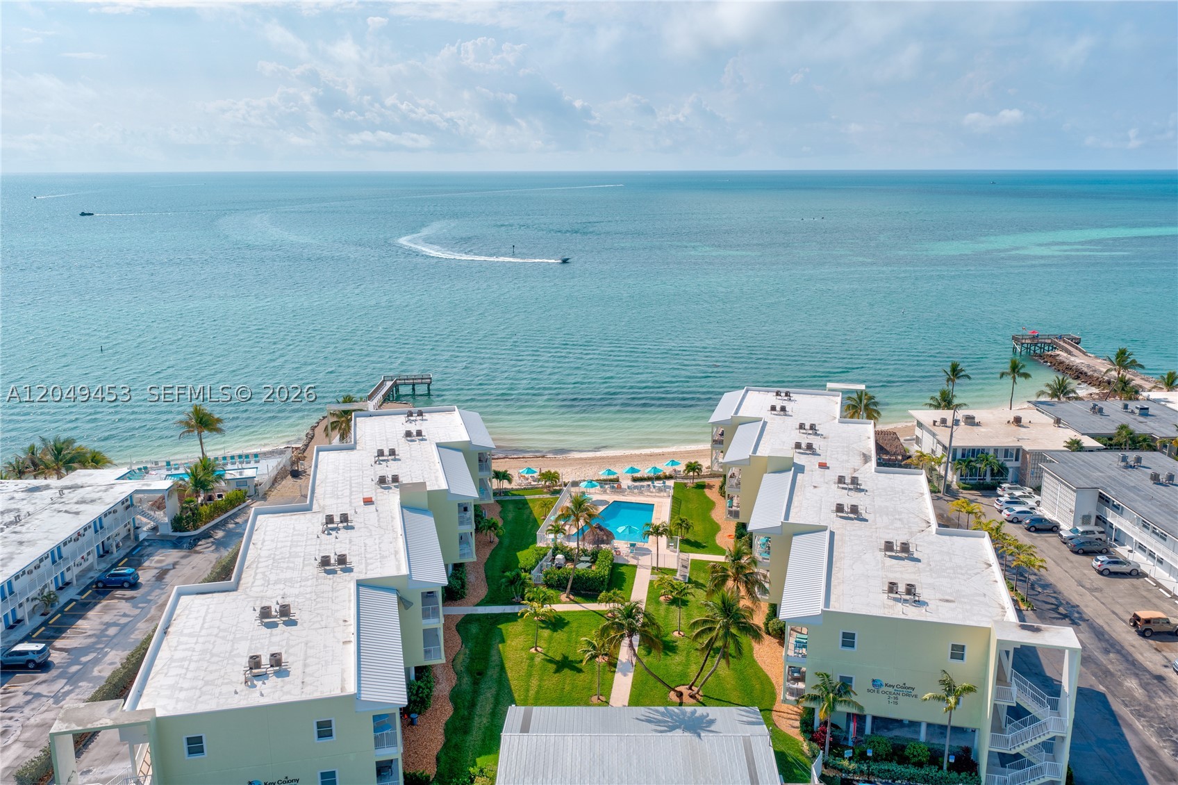 Rarely does a nearly new oceanfront residence with weekly rental eligibility become available in the heart of the Middle Keys. Welcome to Key Colony Beach Club, one of the area's premier waterfront communities.

Built in 2023, this beautifully appointed 2-bedroom, 2-bath residence offers impact-rated glass, 9-foot ceilings, abundant natural light, and an expansive private balcony with breathtaking Atlantic Ocean views from both the living area and primary suite. Offered fully furnished and currently operating as a successful vacation rental, it's ready for immediate enjoyment or investment.

Residents enjoy a heated oceanfront pool, private sandy beach, tiki huts, elevator access, a new fishing pier, private storage, and covered parking for two vehicles. The quarterly HOA includes building insurance, water, cable, and high-speed internet. Ideally located within walking distance to golf, pickleball, marinas, waterfront dining, and all that Key Colony Beach has to offer.