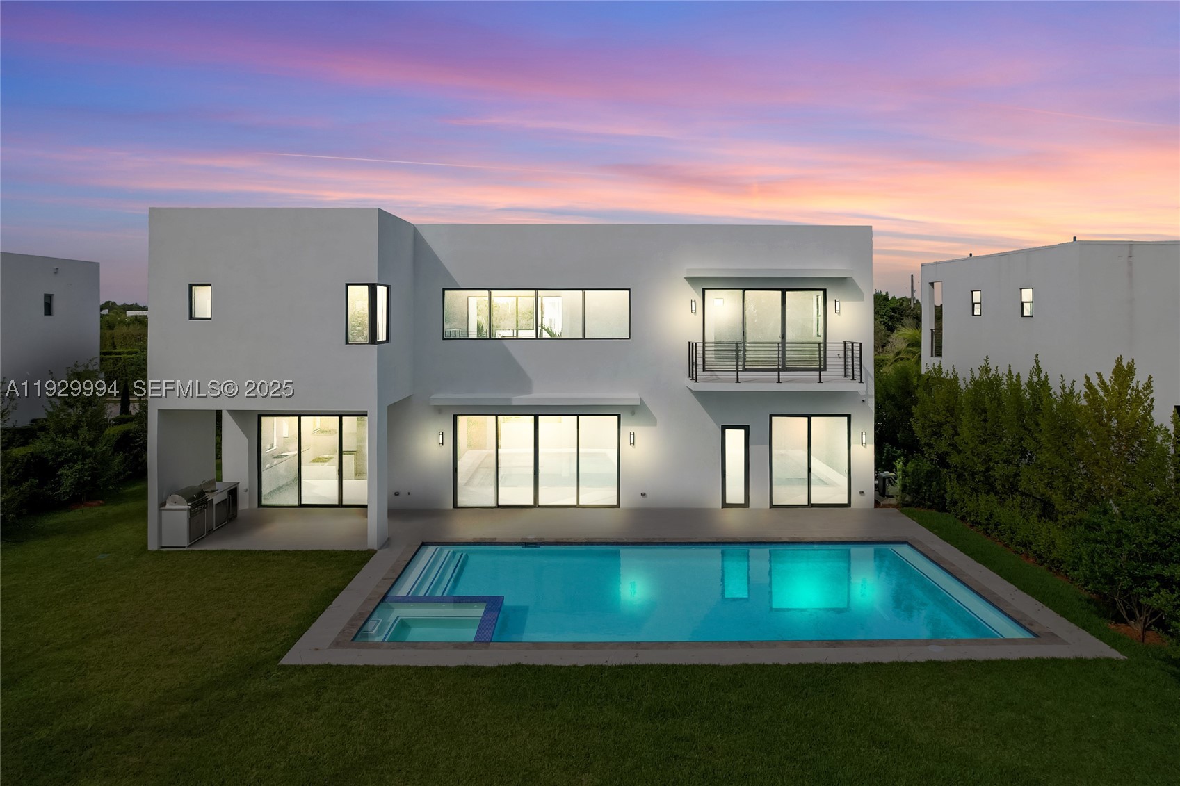 Stunning brand new two-story lagoon front house located in the exclusive community of Botaniko.
It features 5 bedrooms, 5 bathrooms, a powder room, an attached 3-car garage, a huge backyard with a private pool with jacuzzi, and a summer kitchen. Be the first to live in this modern masterpiece designed by world renowned architect Mateu. Built in 2025, the house was just delivered by developer in December and boasts 3,810 Sq Ft of living space over a huge lot spanning 15,933 Sq Ft. The designer kitchen features top-of-the-line appliances (Sub-zero, Wolf, Asko). Enjoy luxurious high ceilings and expansive windows, which provide abundant natural light and a seamless indoor-outdoor flow. The beautiful back yard offers lush landscaping, an oversized pool, and a beautiful lagoon view. The residence has extra upgrades such as 3-zone integrated sound system and security cameras. Botaniko Weston is located right in front of Bonaventure golf club, near top-rated schools, restaurants and shops.