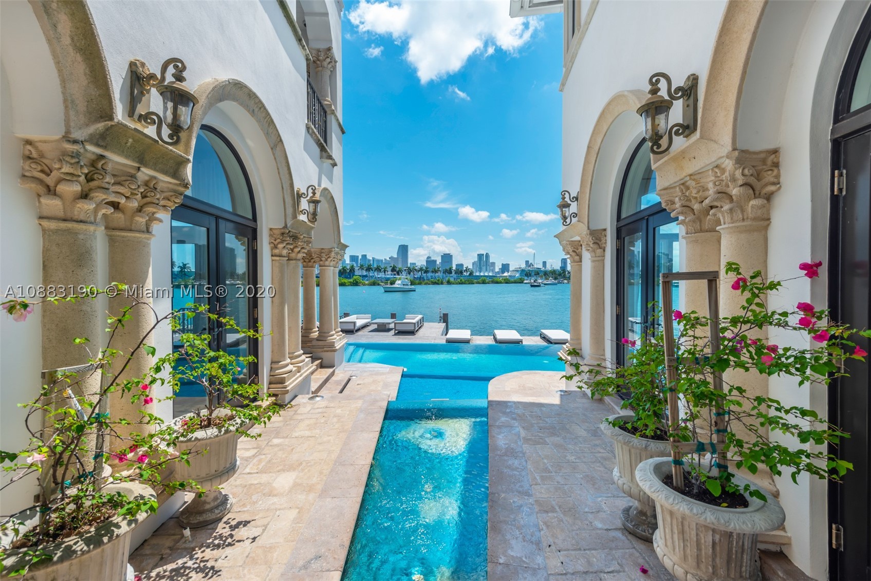 nspired by simplicity. This gated Palm Island Villa is the epitome of Miami Beach living. Offering unobstructed, bay views of the Miami skyline and 80 feet of waterfront with a private boat dock, this home has it all. Renovated in 2017, this stunning villa boasts 5 beds, and 5/1 baths over 6.974 SqFt of Total Area. Updates include marble and wood floors, new doors, new lighting and Creston system. With 24 hour police security and steps away from the Palm Island park and tennis courts, this masterpiece provides for a tranquil setting yet is only minutes from S Beach, Downtown & the Miami International Airport.