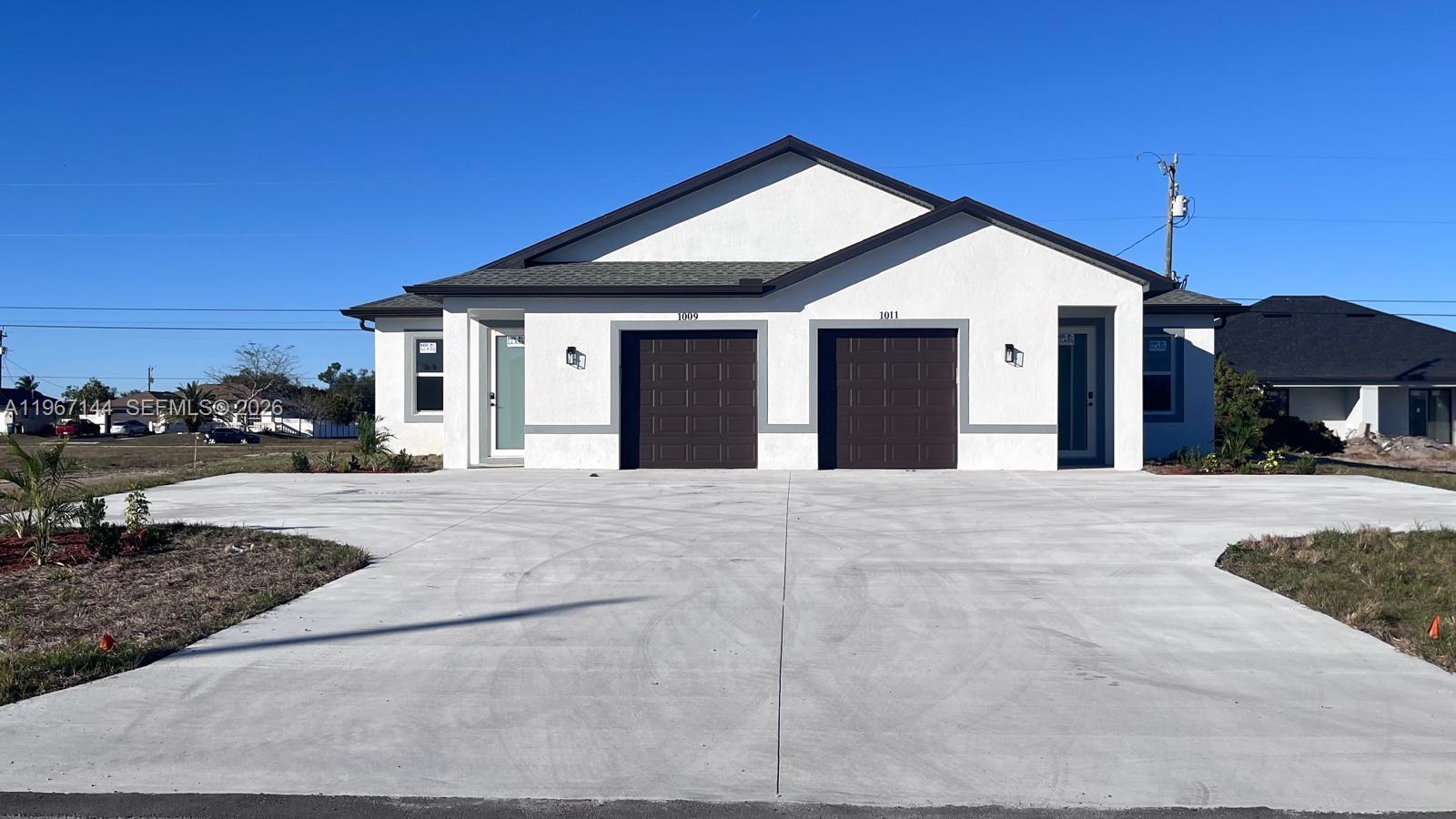 Ready to move in, this brand-new construction duplex in Cape Coral offers a luxurious Southwest Florida lifestyle. The home boasts a total of 1577 square feet of spacious, open-concept living, with 3 bedrooms, 2 bathrooms in each side. High-end finishes: The kitchen has brand-new stainless steel appliances and quartz countertops. Enjoy peace of mind with hurricane impact windows and doors throughout the home. Convenient location: this duplex is ideally situated near great schools, local shopping, dining, and entertainment. Don't miss this rare opportunity to be the first to live in or invest in this immaculate, new Duplex. Schedule a showing today! Se habla Espanol.