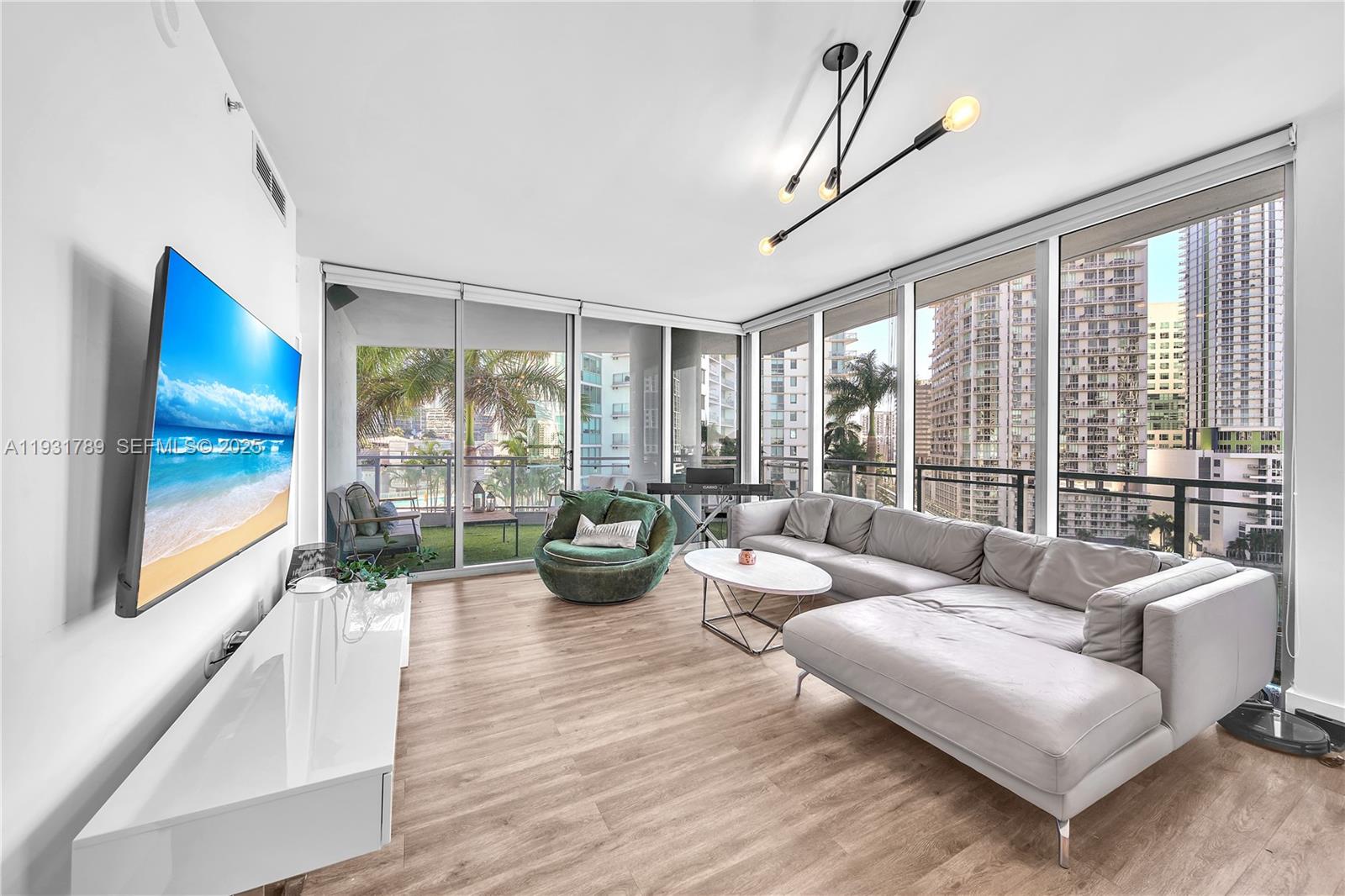 Experience luxury living at The Ivy in the brand new Faena District with this beautifully updated 2-bedroom, 2.5-bath condo on the 12th floor. Includes TWO assigned parking spaces and a storage unit. Motivated seller. Over $70,000 in upgrades throughout, including a brand new AC, new dryer, new doors, and new appliances. The completely renovated kitchen features modern cabinetry and high hat lighting. The primary suite has been upgraded with soffit and high hat lighting, plus a custom built-out closet. The primary bathroom has been updated with a new shower head, valve, and handles. The wraparound balcony has been professionally finished with artificial turf, creating the perfect outdoor space.
Enjoy top-tier amenities including two pools, a gym, hot tub, sauna, steam room, spa, and social and game rooms. The building also offers 24-hour security, two onsite markets, two cafes, a brand new restaurant, a private gym, and a spa. Easy to show! OWNER AGENT. MOTIVATED. Bring your offer!