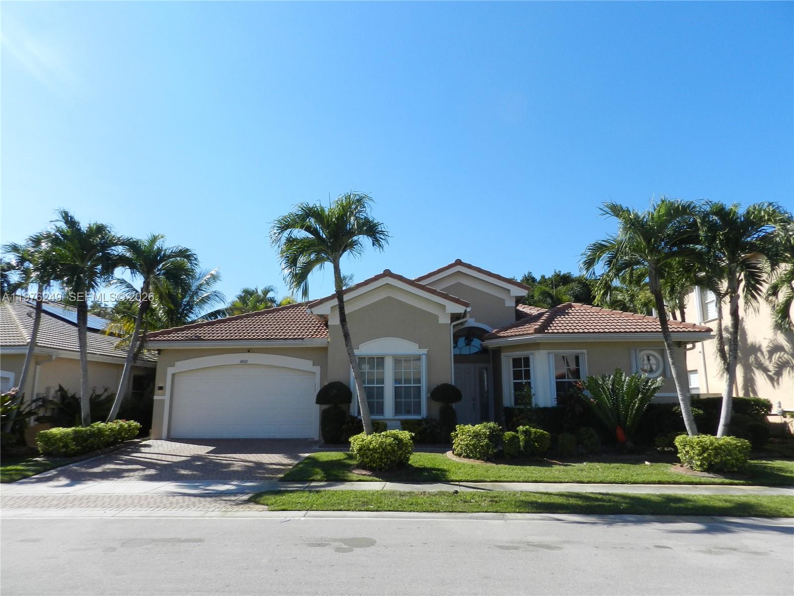 What a gorgeous house! Not your typical rental and shows pride of ownership throughout! *One story *Guard gated entry *Fantastic triple split floorplan featuring spacious bedrooms and high ceilings *Wood flooring & tile throughout *Gorgeous kitchen with wood cabinetry, double ovens, & breakfast nook. *All 3 bathrooms beautifully remodeled *Fenced backyard features a private oasis with covered patio, screened in HEATED pool (with baby gate), upgraded pool light, & low maintenance astro-turf. Other features include High tech front door lock, EV connector in garage, tankless water heater, dual zoned AC system, surround sound speakers throughout home, accordion shutters, & black out shades. Rent includes cable (through HOA), landscaping, pool maintenance, pest control, & semi-annual AC service. Minimum 650 credit score required. No pets permitted. No HOA approval required - fast occupancy available.