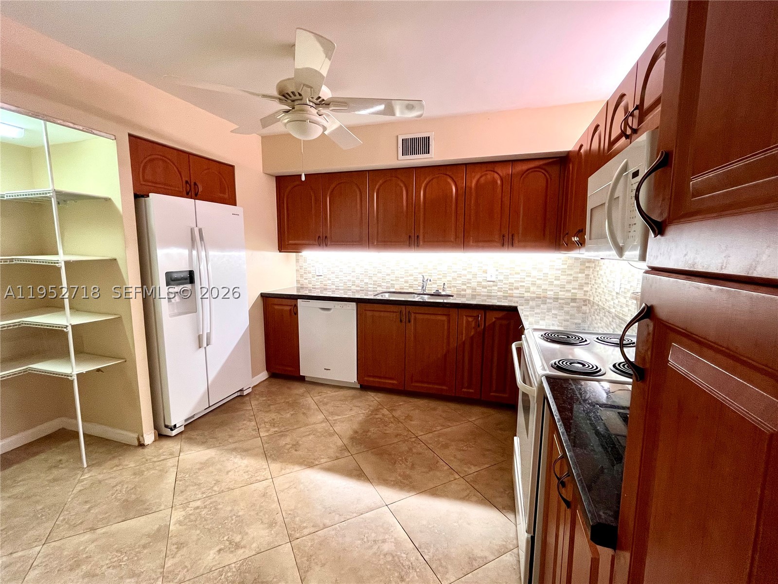 REDUCED...Fabulous Buy Overlooking Gorgeous Pool & Gardens, BEST location on 5th floor, this Stunning 2BR/2BA, "Monmouth" Model...almost 1400sq.ft, set up as Convertible w/pocket doors,(Murphy Bed inc.), ideal for entertaining. Custom Upgraded Oversized Granite Chef's Kitchen, w/LOTS of Space!  Washer/Dryer, relocated into hallway, creating LARGE Storage Area in Kitchen... and tastefully renovated. W/D Hookup is still in Kitchen Pantry, for possible revision if desired. Custom Cherry Wood Cabinetry and Granite countertops, Oversized Marble Tile flooring, except Master Bedroom has carpet. Spacious Screened in Patio, with large Storage/work area. Unique layout, w/endless possibilities. Recently renovated Heated Pool, Jacuzzi/Hot Tub. Newly remodeled Gym, Billiards, Ping-pong, Library, Social Hall, Covered Parking spot deeded w/unit. Close to FTL Airport, Shopping, Restaurants,  Hard Rock Hotel & Casino, I-95, TY Park, Turnpike, even the Beaches. Spacious apartment w/ Lovely walking paths, inside and around the complex, nestled in a 24/7, Secure Guarded Gated community...in Beautiful, safe Emerald Hills. like a "Secret Place". Several Houses of Worship within walking distance. Service Animals allowed, pending approval
