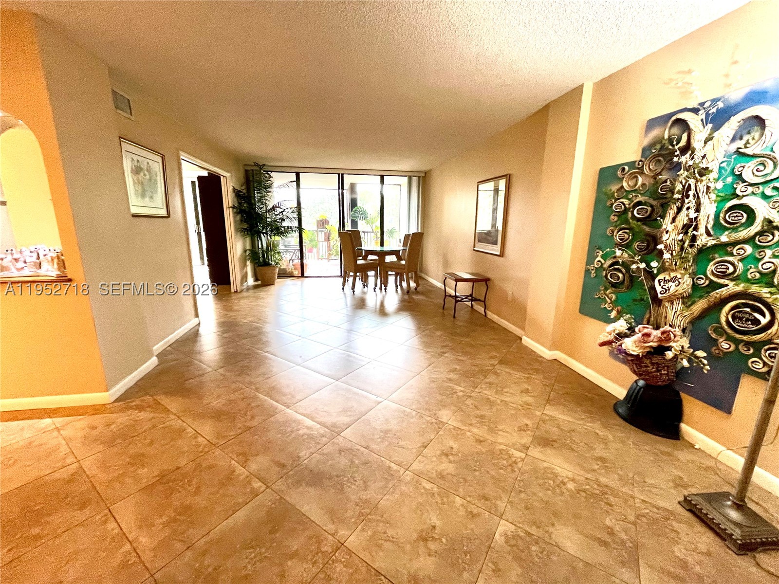 REDUCED...Fabulous Buy Overlooking Gorgeous Pool & Gardens, BEST location on 5th floor, this Stunning 2BR/2BA, "Monmouth" Model...almost 1400sq.ft, set up as Convertible w/pocket doors,(Murphy Bed included), ideal for entertaining.  Upgraded Chef's Kitchen, w/LOTS of Space!  Washer/Dryer, relocated into hallway, creating LARGE Storage Area in Kitchen... and tastefully renovated. W/D Hookup is still in Kitchen Pantry, for possible revision if desired. Custom Cherry Wood Cabinetry and Granite countertops, Oversized Marble Tile flooring, except Master Bedroom has carpet. Spacious Screened in Patio, with large Storage/work area. Unique layout, w/endless possibilities. Recently renovated Heated Pool, Jacuzzi/Hot Tub. Newly remodeled Gym, Billiards, Ping-pong, Library, Social Hall, Covered Parking spot deeded w/unit. Close to FTL Airport, Shopping, Restaurants,  Hard Rock Hotel & Casino, I-95, TY Park, Turnpike, even the Beaches. Spacious apartment w/ Lovely walking paths, inside and around the complex, nestled in a 24/7, Secure Guarded Gated community...in Beautiful, safe Emerald Hills. like a "Secret Place". Several Houses of Worship within walking distance. Service Animals allowed, pending approval