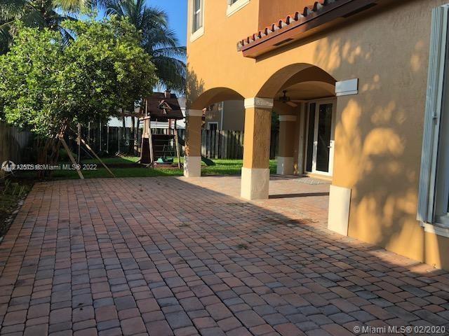 Remarkable spacious two story home with new roof spanish style 3/2 plus 1/2 bath. Loft upstairs. Porcelain tile throughout first floor, wood vynil on second floor. Large bedrooms and onsuite in master with wood cabinetry in all baths, large walk in closets, window treatments, accordion storm shutters,laundry with washer/dryer, formal dining, living plus family room. Spacious kitchen with Stainless steel appliances and granite countertops with peninsula. Larged roofed terrace with nice backyard and swings for kids. Well groomed. Large 2 car garage, excellent community and neighbors. Great for family. Excellent opportunity to rent this home and enjoy all it has to offer. 24 hr security,community pool, playground plus volleyball sanded area. Includes yard maintenance. Call listing agent.