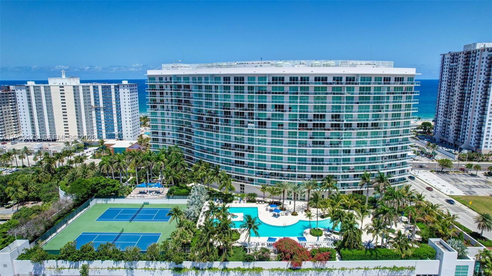 Experience elevated coastal living from this elegant 14th-floor residence at The Plaza at Oceanside, offering breathtaking, unobstructed Intracoastal views. Beautifully finished and thoughtfully designed, this exceptional home features a spacious European-style kitchen with premium appliances. The desirable 2-bedroom floor plan is enhanced by a large den, which is ideal as a third sleeping area, private office, or sophisticated flex space to suit your lifestyle. Indulge in resort-inspired amenities including a state-of-the-art fitness center, professional tennis courts, billiards, luxury pool, golf simulator, and complimentary continental breakfast at the News Café. Secured resident parking also includes convenient EV charging stations. Enjoy spectacular sunset views from the expansive ±375-square-foot terrace, perfect for relaxing or entertaining. Ideally located just steps from the beach, upscale dining, shopping, and vibrant nightlife, this residence offers the perfect blend of luxury, comfort, and convenience. A must see.