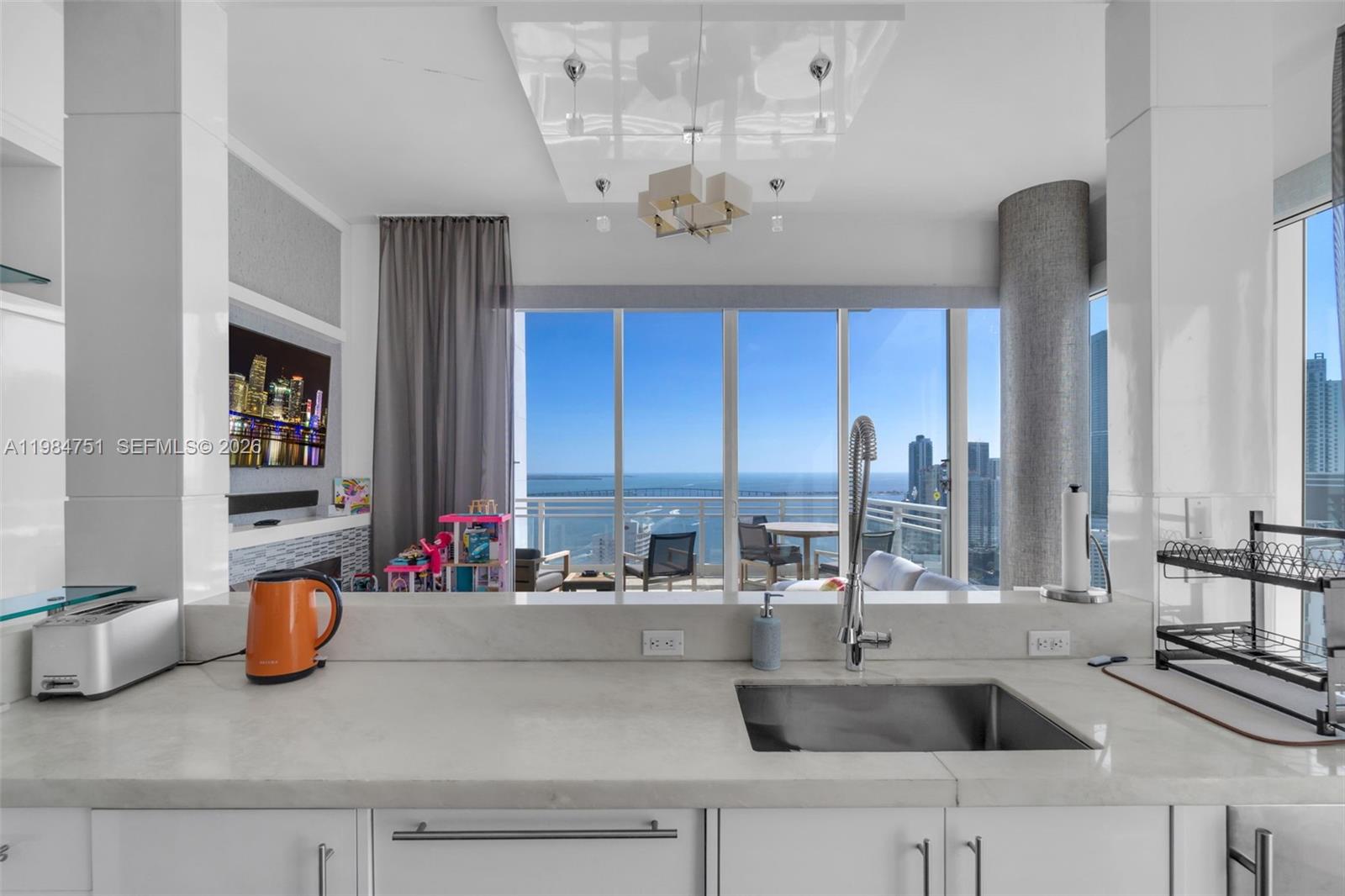 Experience elevated living at Unit 2904 in Asia Brickell Key, a premier high-rise residence showcasing sweeping views of Biscayne Bay and the Miami skyline. This 3-bedroom + den, 4.5-bath home offers 2,631 sq ft of refined interiors, complete with a private elevator, soaring ceilings, and floor-to-ceiling windows.

The chef’s kitchen features top-of-the-line appliances and sleek contemporary finishes. Expansive terraces provide stunning sunrise and sunset vistas.

Residents of Asia enjoy exclusive resort-style amenities, including a pool, spa, fitness center, concierge services, valet, and 24-hour security—all within a private island setting just moments from Brickell’s vibrant lifestyle.