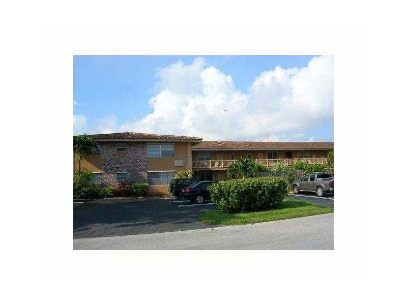 Beautiful 2 bedrooms, 2 bathrooms, nice and quiet street in the heart of Coral Springs. This unit features pergo wood and tile flooring throughout, freshly painted in Ivory. Corner unit with a lot of light. New painting. Less than 2 year NEW AC. NEW elect ric system. Washer and Dryer on site. Energy saving water heating. Close to great schools. Water included. (Cat or dog up to 10 lbs - per association). Fast Approval.