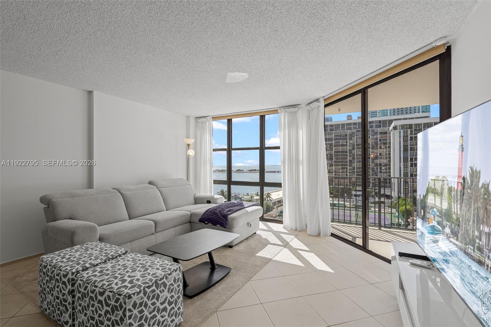Experience exceptional waterfront living in this beautifully updated 2-bedroom, 2-bath condo, set on a rare and expansive bayfront lot, this residence offers sweeping water views from a spacious balcony accessible from both bedrooms. Inside, the home features a large modern kitchen equipped with stainless steel appliances and ample cabinet space, creating a perfect setting for cooking and entertaining.
This exclusive community provides a resort-style lifestyle with a wide range of amenities, including six tennis courts, a fully equipped gym, sparkling pools, a spa, playground, picnic and BBQ areas, meeting rooms and more. Additional storage is conveniently located in the building’s basement.
Ideally positioned with direct access to U.S.-1 and I-95—without navigating the traffic of Brickell’s Financial District—you’re just minutes away from Downtown Miami, world-famous beaches, Miami International Airport, and high-end dining and shopping options. Boat slips are available for rent, and complimentary valet parking is provided for guests.