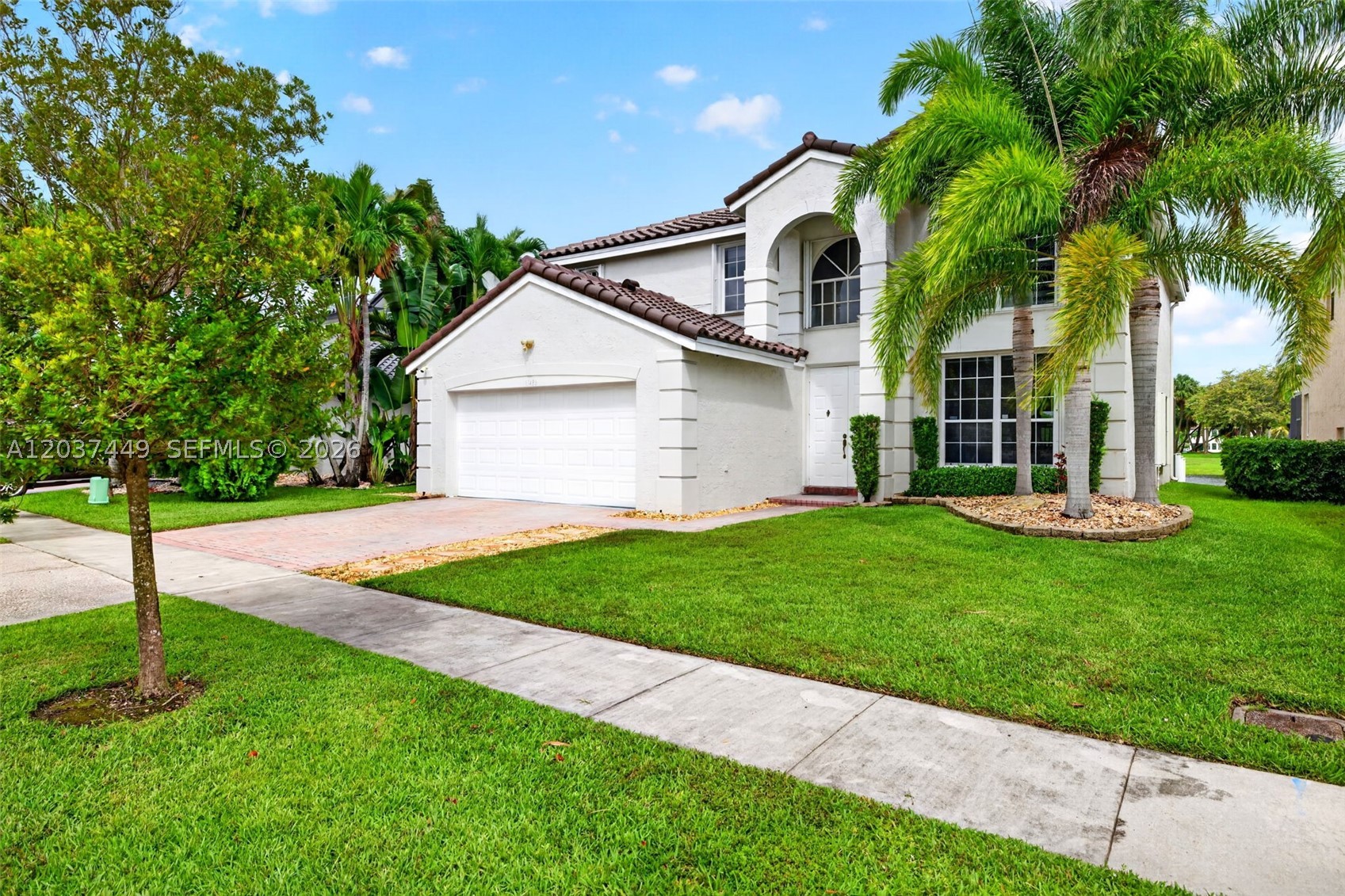 Enjoy spectacular lake views from this beautifully maintained home located in the highly sought-after Silver Lakes community. Set on a premium waterfront lot, this residence offers the perfect blend of updates, space, and functionality. Highlights include a 2025 roof, renovated kitchen, spacious living areas, and a highly desirable first-floor bedroom and full bathroom, ideal for guests, in-laws, or a home office. The home's thoughtful layout provides flexibility for today's lifestyle while maximizing comfort and livability. Step outside to a screened-in patio overlooking the lake, complete with elegant travertine marble pavers, creating the perfect setting for outdoor dining, entertaining, or simply relaxing while enjoying the peaceful water views.