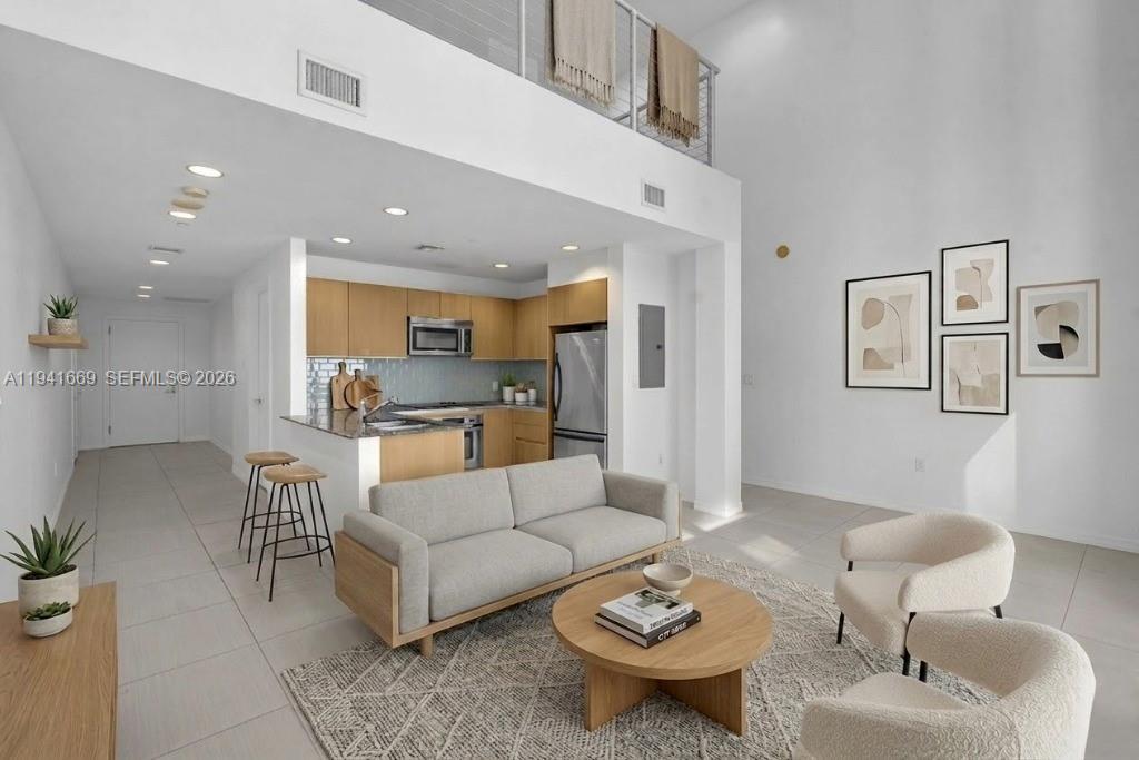 Stunning 1BR/1.5B loft in the heart of Miami’s financial district, located on the 24th floor of 1050 Brickell, combining panoramic city views with modern amenities. This open-concept unit features high ceilings, large windows, Italian-style cabinetry, granite countertops, and stainless steel appliances, washer/dryer in the unit, and tiled floors throughout. Enjoy the resort lifestyle amenities that the building offers, such as: sundeck with a pool and hot tub, fitness center, yoga room, steam rooms, virtual golf, billiard room, business center, and more. Enjoy the convenience of 24-hr valet parking. Located steps from Mary Brickell Village & Brickell City Centre. Ideal for those seeking luxury in Miami's financial district, close to beaches, Key Biscayne, Coconut Grove, and Coral Gables.