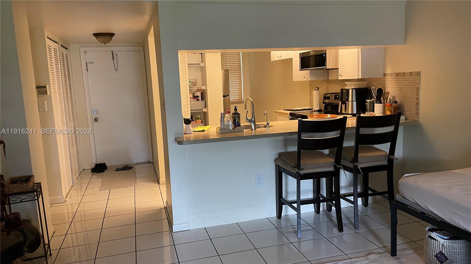 ***Garden Level 2/2 Condo with the Convenience of a House***
Large Airy living room, with large screened porch facing a beautiful garden, new hurricane impact windows, new AC, and a full size washer/dryer in unit. Community pool across your unit, with hot tub and bbq area, bike storage, carwash area and additional storage also a plus. Easy parking feet away from unit's front and back entrance. No Age restrictions. Rentals allowed. Building has a new roof, 40 year inspection certification complete, no assessments. 
Excellent location! Walk across to the Plantation Town Shops with Publix, Starbucks, UPS and many other restaurants, and other shops accessible. Minutes away from many universities,  other shopping centers, Sawgrass, FLL airport and the beautiful beaches.