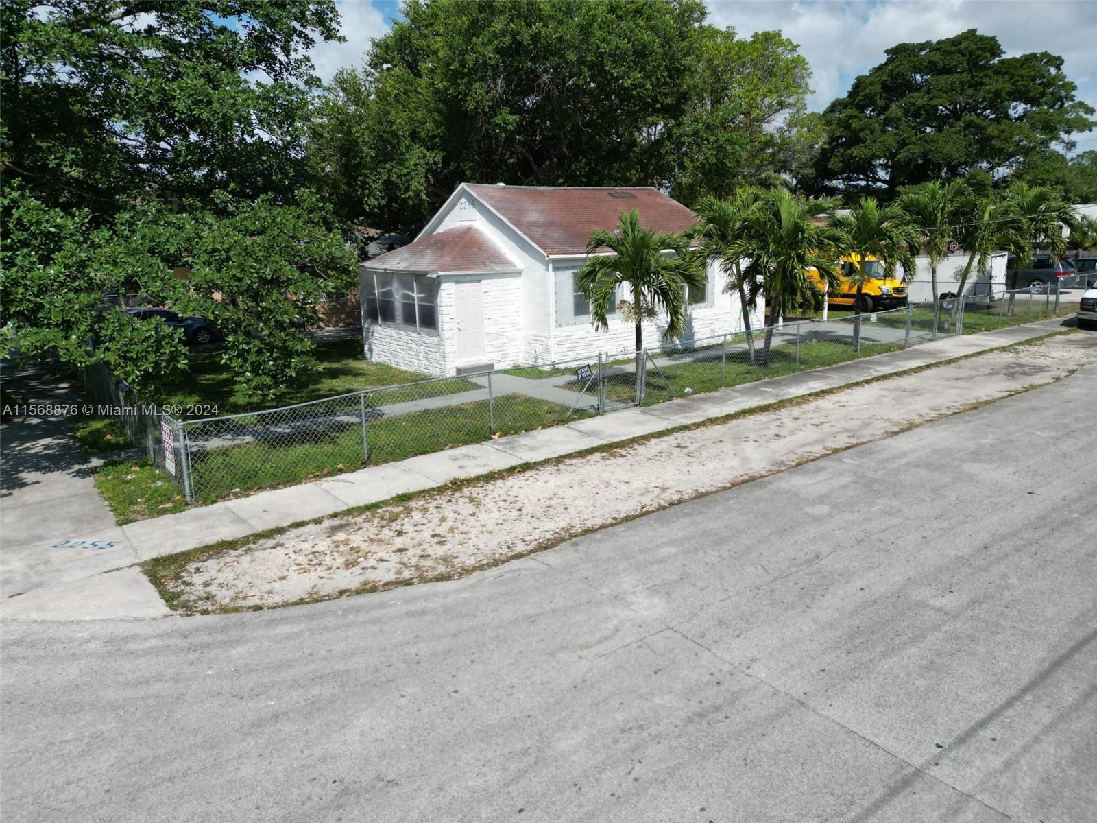 Spacious 1136 square feet! Fully renovated 3/2 in a desirable location: near train station and airport. It is a cool, breezy corner lot, and mature trees provide shade. A large mango tree bears fruit every year. Comes with a utility room with a washer and drier, adjacent to an attached carport, with a separate entrance from the carport to the kitchen. Central AC, fully tiled floors, and stainless steel appliances in kitchen, including a dishwasher and sink disposal. Fully fenced, large yard.
