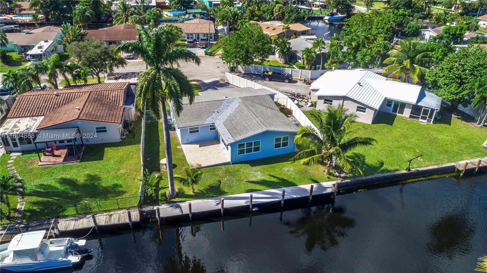 Hurry and steal this Real South Florida deal- Hidden boaters GEM! Amazing views from sunrise to sunset in this Ocean Access home.  Bring on the boats, 70 feet of private dock means options are endless for afternoon sunset cruises, early morning fishing, or out to dinner on the boat.  Two ways to the inlet provides plenty of clearance for BIG boats.  This 3/2 home is updated, cool and clean with room for everything. Large bedrooms, lots of closets, utility room and garage.  Ideally situated on a cul-de-sac street in a quiet community, but yet close enough to enjoy all the excitement the city has to offer, 5 mins to shopping & Hard Rock, 10 mins to airport, and 15 mins to the beach. Best Priced Ocean Access HOME in all of Broward County!!!!