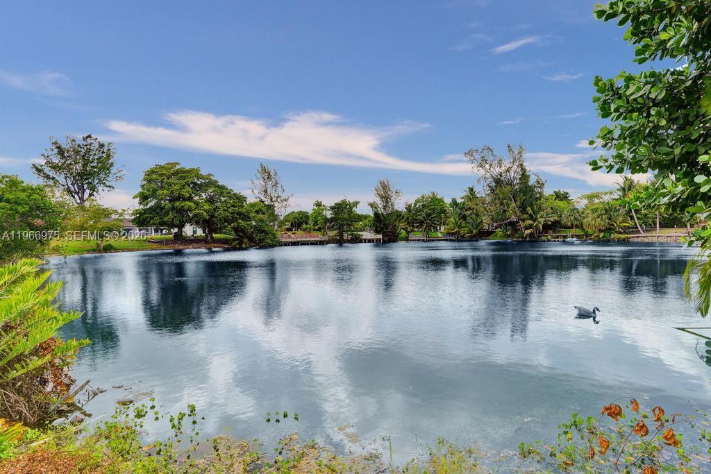 Rare opportunity to own a true lakefront home in the highly desirable  Enchanted Lakes area. Situated on an oversized lot with direct freshwater lake frontage, this residence offers exceptional indoor-outdoor living and endless potential to customize or expand. The bright, open layout features generous living areas that flow seamlessly to a spacious backyard with tranquil lake views—perfect for entertaining, family gatherings, or creating your dream outdoor oasis (room for pool).

This property stands out for its prime waterfront setting, privacy, and flexible floor plan, ideal for families or buyers seeking space to grow. Enjoy the serenity of lakefront living while being just minutes from Aventura Mall, top-rated schools, houses of worship, beaches, major highways, and dining. A unique opportunity to secure a waterfront lifestyle at an accessible entry point in one of North Miami-Dade’s most sought-after neighborhoods.