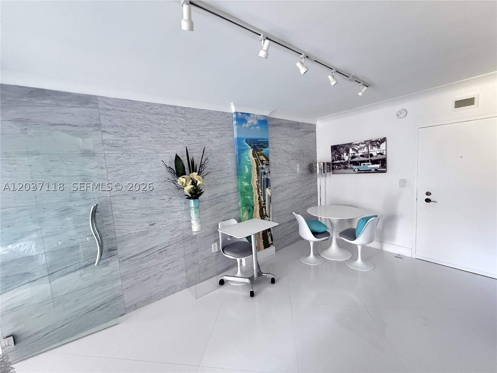 Beautifully renovated, fully furnished studio in bayfront building with pool and gym.  Elegant glass divider make this bright space feel like a 1 bedroom.