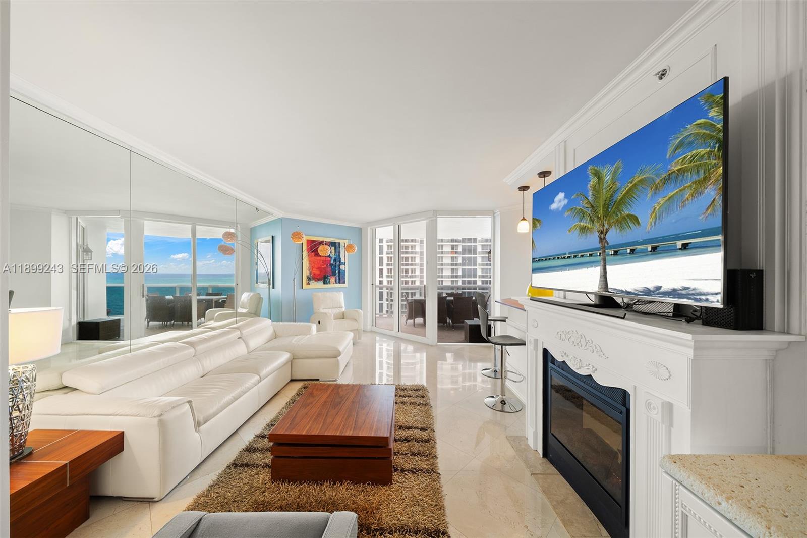 Enjoy spectacular views of the ocean, bay, and city from this beautifully appointed 2-bedroom, 2-bath residence with a den—currently used as a third bedroom. The primary suite features a large walk-in closet and a spacious bathroom with separate Jacuzzi tub and shower. The kitchen flows seamlessly into a bright living and dining area, leading to an expansive terrace perfect for taking in the views. Marble floors throughout add elegance and warmth. The second bedroom also enjoys terrace access. The building offers outstanding amenities and services and is ideally located in one of Miami Beach’s most coveted oceanfront condos.
