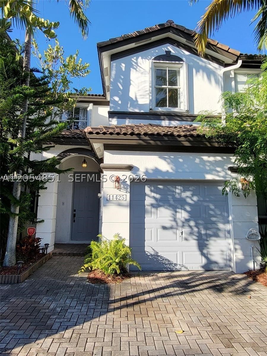 WILL NOT LAST!! VERY DESIRABLE HOME IN PRESTIGIOUS WINDWARD AT DORAL COMMUNITY, 3 BED 2 BATH SAINT VINCENT MODEL TOWNHOUSE, WITH AN SPECTACULAR LAKE VIEW. TILE ON THE FIRST FLOOR, BERVET CARPETS IN THE SECOND. FINISHED PATIO. GATED AND QUIET COMMUNITY WITH ALL AMENETIES OF ISLAND AT DORAL CLUB HOUSE. UNIT IS NOW VACANT AND ON LOCK BOX COMBO.