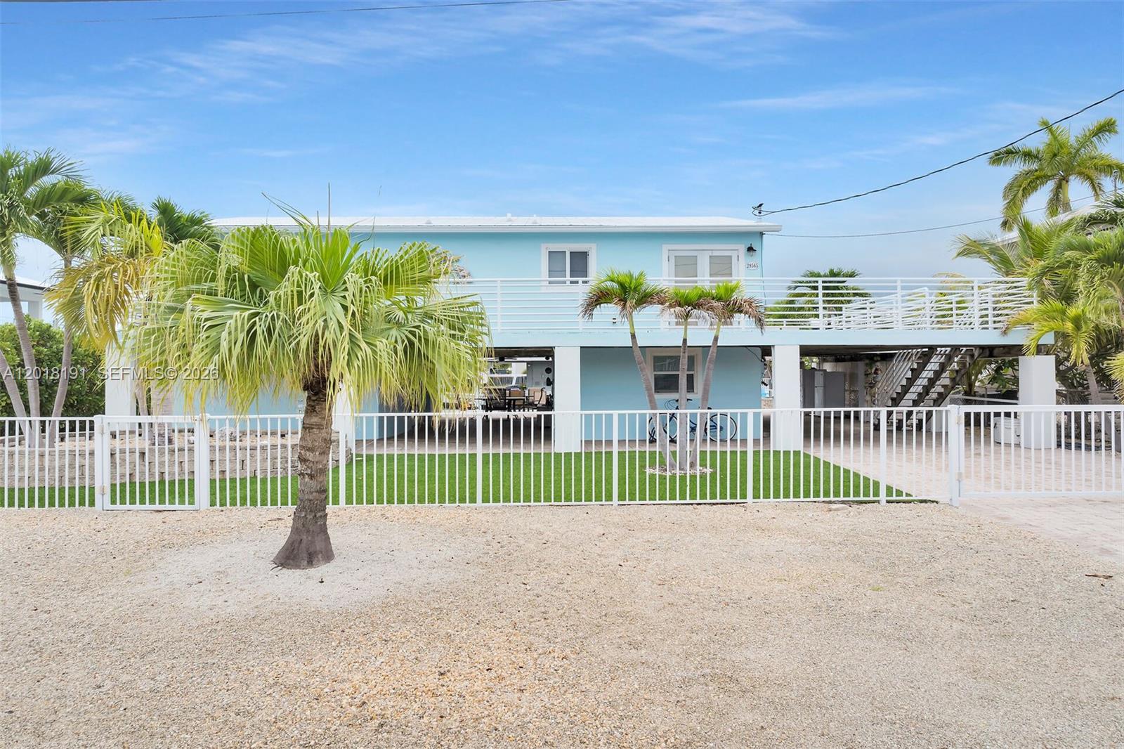 Waterfront retreat with excellent boating access in the heart of Big Pine Key! Home has 15k boat lift, fish cleaning table and clear deep canal. This elevated home features a private dock, canal frontage, and plenty of room for boats, trailers outdoor entertaining and out door showers. Open-concept living areas, abundant natural light, and spacious porches create the perfect Keys getaway or full-time residence. Conveniently located near world-class fishing, diving, turquoise blue waters, sandbars and the Lower Keys’ laid-back charm. 4 bedrooms, 3 baths, there are 2 bedrooms and 1 bath upstairs and 2 bedrooms, 2 baths downstairs. Home is fully furnished and ready to use.