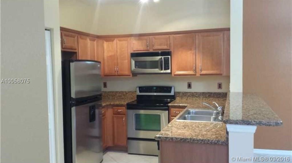Open Balcony /Hurricane Shutters/Dishwasher / Disposal / Dryer / Electric Water HeaterCard/Electric Gate / Clubhouse / Community Pool / Exercise Room / Guard At Gate  BEAUTIFUL 2/2 CORNER Unit, Upgraded floors, tile and wood laminate throughout, Large Stand up Shower in Master Suite, Upgraded kitchen with SS appliances, 1 Car Garage, Association fee includes cable, insurance and water. Mint Condition and tastefully done!