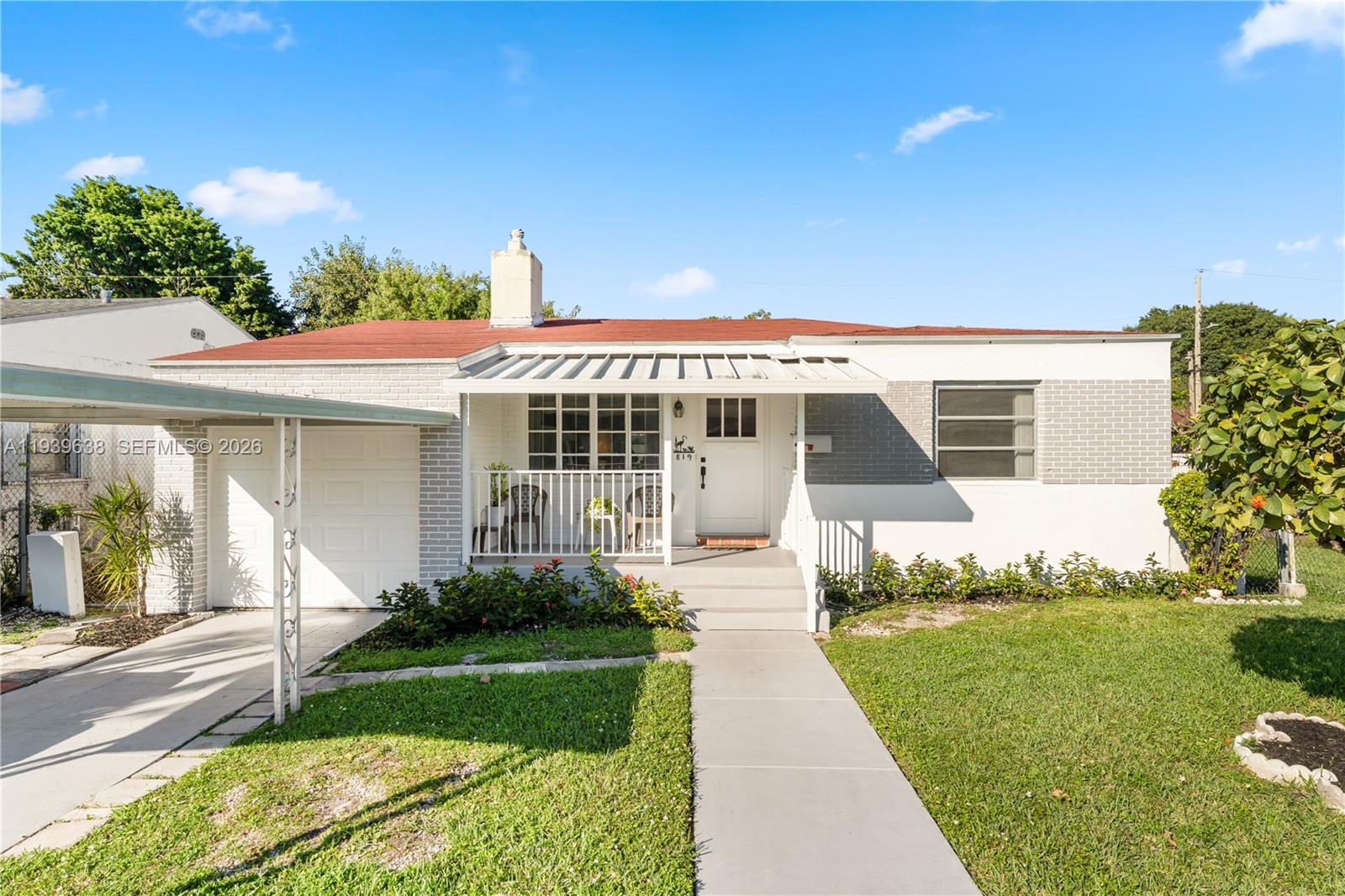 Charming 2 bedroom, 1 bathroom home with a 1-car garage and a sun-filled Florida room, located in the Bay Vista Park neighborhood. Features original hardwood floors throughout the living room and bedrooms, adding classic character. Property is located near major highways and just a short drive to the Design District, Midtown, Wynwood, top-rated restaurants, South Beach, and more.  Ideal for end users or investors seeking a well-located property with strong potential.