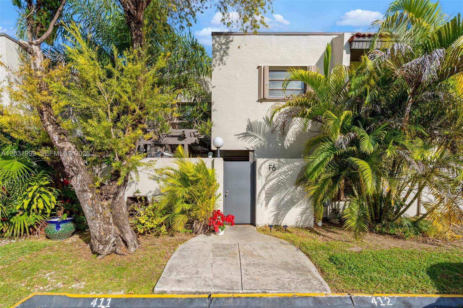 Charming 3-bedroom, 2.5-bath townhouse-style condo in the sought-after Oasis community of South Miami. This split-level unit features a first-floor entry, private patio, open porch, and two covered carport spaces. Enjoy an updated kitchen with dishwasher, disposal, microwave, refrigerator, washer and dryer. The primary bedroom is conveniently located upstairs. HOA covers cable TV, landscaping, pool, recreation facilities, and community management — true lock-and-leave living. Pets welcome. Sold as-is. 24-hour notice required. Submit all offers via MLS Offers. Access through Oasis entrance at 48th & 67th Ave.