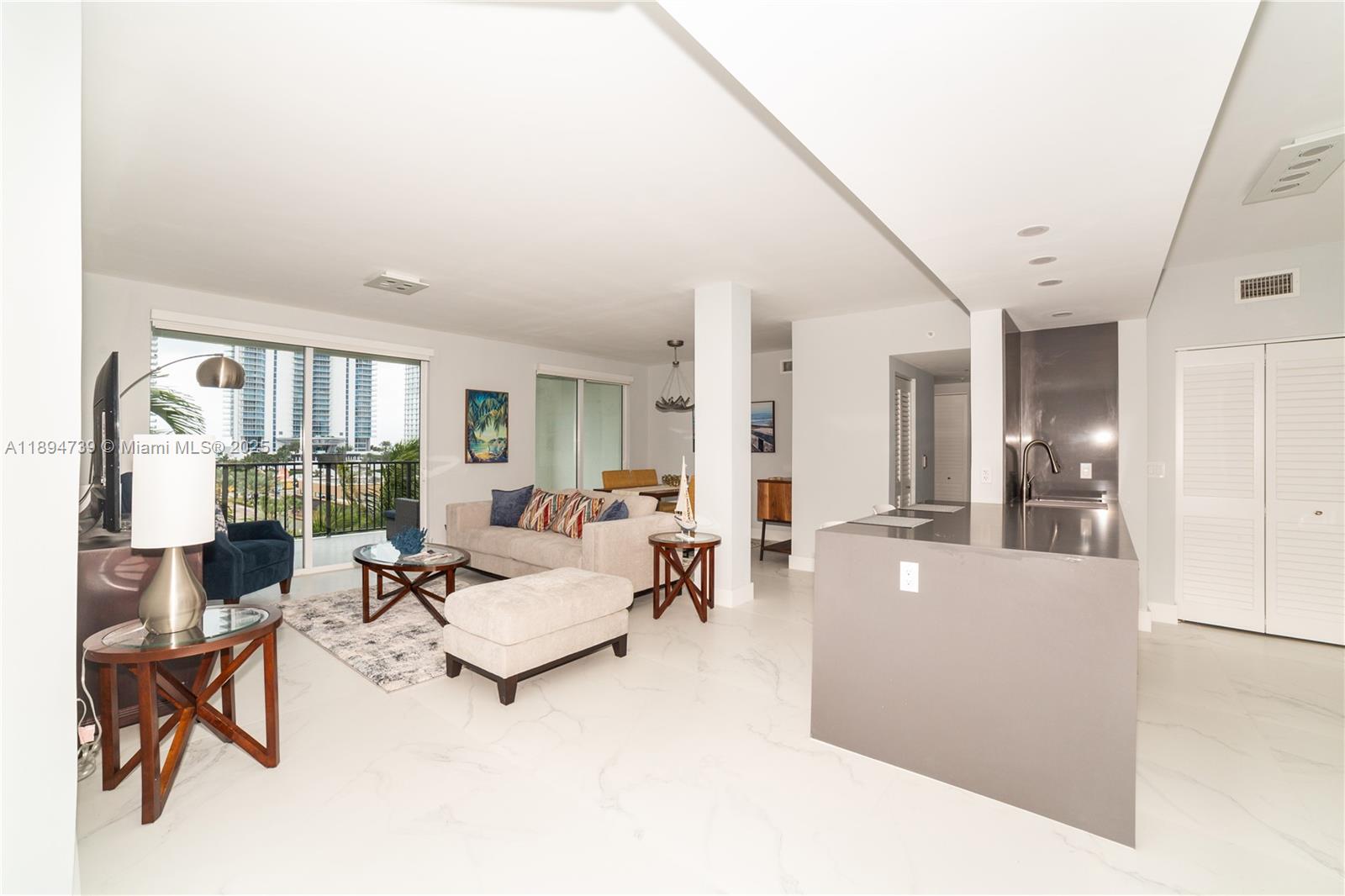 Penthouse Corner Unit – Ocean Views – Fully Renovated. Rarely available on top floor, this is the largest model in a beautifully maintained Mediterranean-style community. Flooded with natural light. This furnished unit has been newly renovated with premium finishes and high-end materials throughout. Enjoy a spacious layout, two assigned parking spaces, and expansive windows showcasing panoramic ocean and skyline views. Resort-Style Amenities Include: Two heated pools & jacuzzi, modern fitness center, bike storage, kids’ playroom, business center & conference room. Bldg. is Pet-friendly with no size restrictions. All this in an unbeatable location: In the heart of Sunny Isles Beach Surrounded by A-rated schools, walking distance to the beach, Top restaurants, shopping, parks, and more!