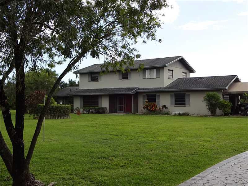 A must see!  This 5 BR/4 BA house sits on 4.62 acres of land. Double wooden front doors. Sliding glass doors off the family room lead to the pool. The kitchen as eat-at counter and a pass through to the pool.  Breezeway to the pool house which has living/ great room along with a wet bar and 1 BR and 1 BA. 2 car garage with automatic garage door opener. Pool/spa is covered with a paved floor.   Pole barn has concrete slab.  Separate in-laws quarters.