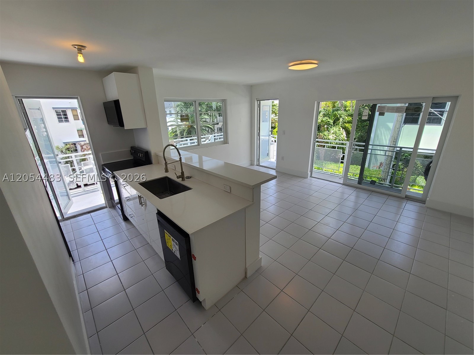 Updated 700sqf corner unit with new Kitchen, Black Stainless Steel Appliances, Bathroom, A/C split system, Impact Windows! Beautiful corner unit, available September 1st.  Call today for a showing or additional information!!