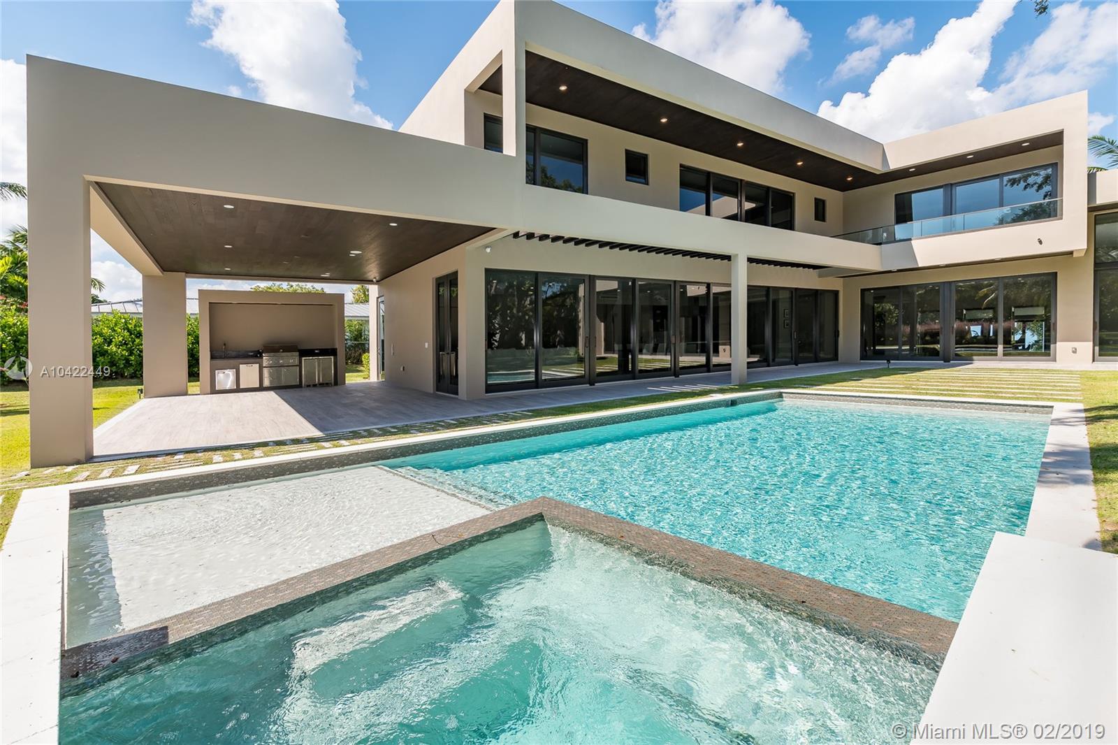 COMPLETED in 2018, this modern masterpiece is conveniently located in a walled community in the prestigious and quiet area of Pinecrest. Boasting a 39,508 SF LOT, the brand new home features stunning OAK TREES throughout the property and an OUTDOOR ENTERTAINMENT area with full BBQ and dining, as well as infinity pool and spacious yard. With 7,016 SF of interior space/8,864 adjusted SF and 6 bedrooms/7.5 bathrooms plus an additional den for gym or office, each room offers glass FLOOR TO CEILING WINDOWS with views of the garden and pool. Top of the line attention to detail throughout such as Italian cabinetry, Miele appliances, Italian Porcelain floors and Quartz countertops.