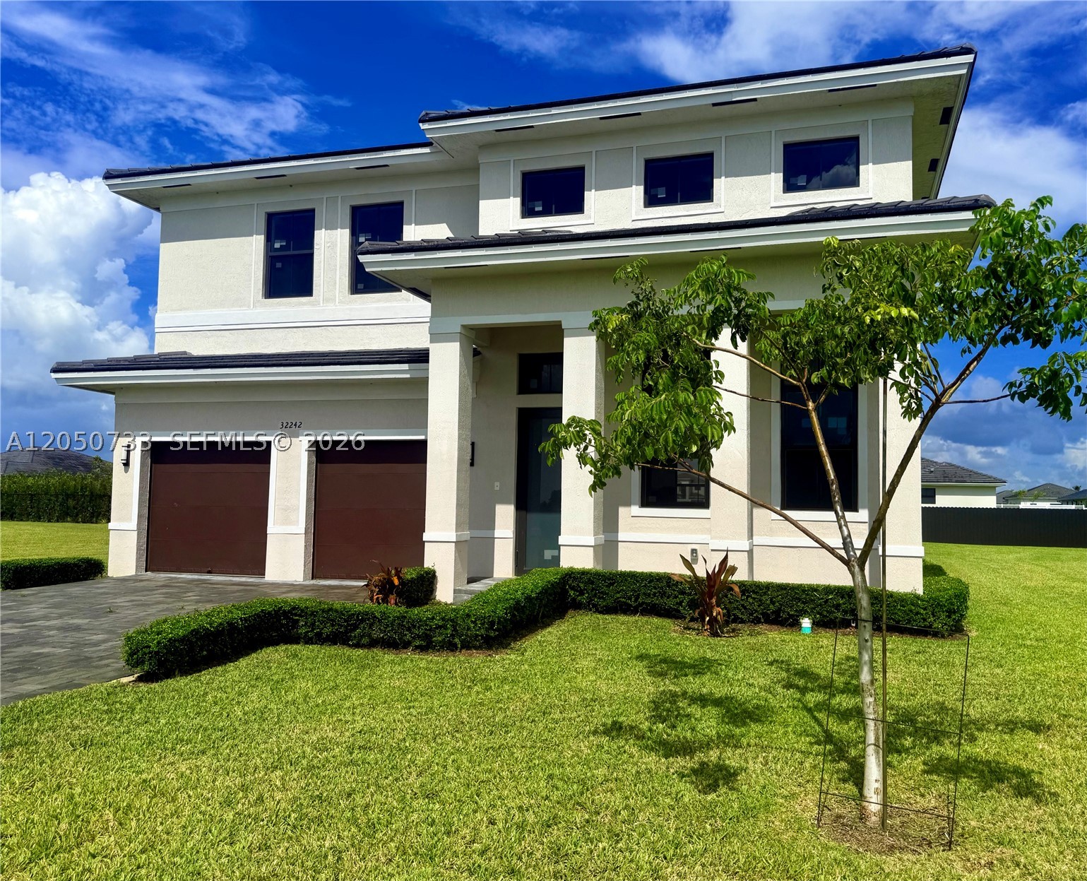Beautiful 5BR/4BA contemporary home in a growing Homestead community. This bright, open-concept floor plan features a neutral color palette, sleek tile flooring, and full hurricane impact windows and doors throughout. The chef’s kitchen boasts quartz countertops, a large island, stainless steel appliances, and ample cabinet space, opening to a spacious living/dining area perfect for entertaining. Convenient downstairs bedroom and full bath are ideal for guests or in-laws. Upstairs includes additional spacious bedrooms with clean, modern finishes.
Step outside to your private backyard oasis featuring a pristine pool and covered patio. Rent includes pool and lawn maintenance for your convenience! The property also comes with a 2-car garage. Excellent location with easy access to major highways, top schools, shopping, dining, and parks. Landlord covers repair expenses that exceed $400. Easy to show and move-in ready! This home offers the perfect blend of style, space, and comfort.