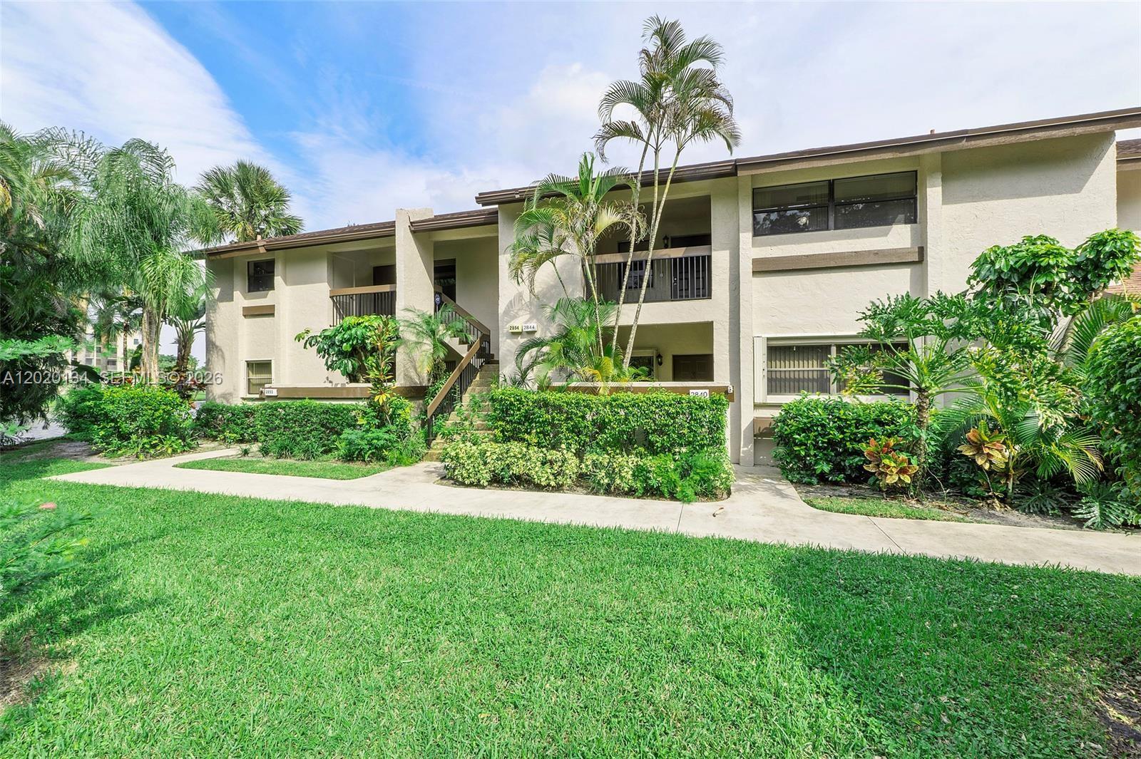 Enjoy stunning water and preserve views from the moment you enter this beautifully updated and rarely available 2-bedroom, 2-bathroom residence in the highly desirable Pond Apple I community. Offering a spacious and inviting layout, this condo features wood-look tile flooring throughout the main living areas and bedrooms, creating a seamless blend of warmth, sophistication, and modern design.

LOW DOWN PAYMENT OPPORTUNITY AVAILABLE FOR QUALIFIED BUYERS — making this an exceptional opportunity to own in one of Coconut Creek’s most desirable communities. 

Both bathrooms have been tastefully renovated with contemporary finishes, creating a refined and comfortable living experience. Relax from your private living space while enjoying tranquil wide canal and preserve views that make this home truly special.

The building has successfully completed its 40-Year Recertification and all required improvements, providing added confidence and peace of mind to future owners. Association fees remain affordable, with a quarterly HOA fee of $1,833 and a quarterly Township Recreation Fee of $193 (combined total approximately $675 per month). HOA fees include basic cable, water, trash removal, and exterior building insurance.

This pet-friendly community welcomes dogs up to 20 pounds and offers an exceptional combination of value, convenience, and scenic surroundings. Don’t miss this opportunity to own a move-in-ready residence in one of the area’s most desirable communities.