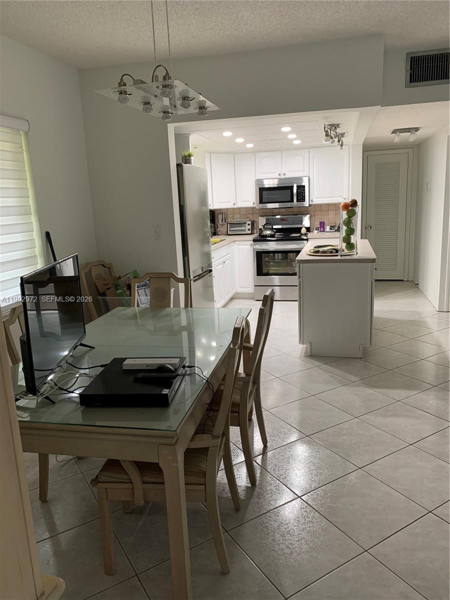 FLASH SALE!!! $165,000. reg. $215,000. MAKE your OFFER NOW!!!!! Welcome to your cozy CORNER UNIT, 1 bedroom, 1 bathroom. SCREENED FLORIDA ROOM, spacious living area with open space. RENOVATED WITH PERMITS(save 1 year delay!) CORNER UNIT: FULLY ILLUMINATED with large windows! Spacious bedroom with ample closet space. modern shower.Designated parking space. minutes away from shopping, dining. MAKE AN OFFER NOW!  CORNER UNIT, plenty of natural luminosity, with 2 large windows in the bedroom, 2 big windows in the living room, one large window in the dining room, and one in the kitchen, ALL OPEN SPACE! Refrigerator excluded. 2 minutes away (0.5 miles) from NEW HOLLYWOOD GOLF. Land is owned. $50,000. alarm is paid. NO rental before 18 months of occupancy.