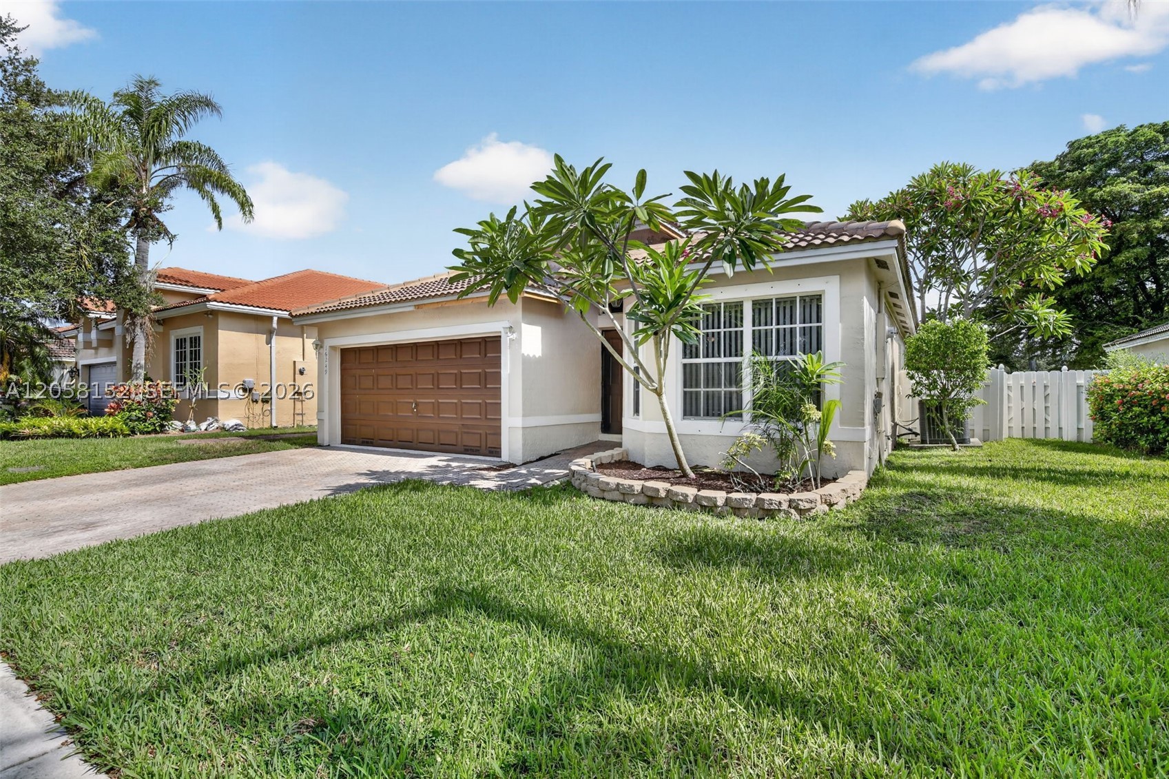 BRAND NEW ROOF on this lake front 3/2 in gated community. Full hurricane shutters and a sizeable fenced back yard suitable for kids and pets to run. Inside find an an open concept great  room that can be a living room dining room combo or whatever you like. Spacious  Primary bedroom suite has walk-in closet and updated bathroom. 2 additional bedrooms have recently received new laminate flooring and 2nd bath was just redone. Eat-in Kitchen has granite counters, & stainless steel Maytag appliances. Community pool and playground complete this package deal. And by the way, NO ASSOCIATION APPROVAL OR APPLICATION FEE.