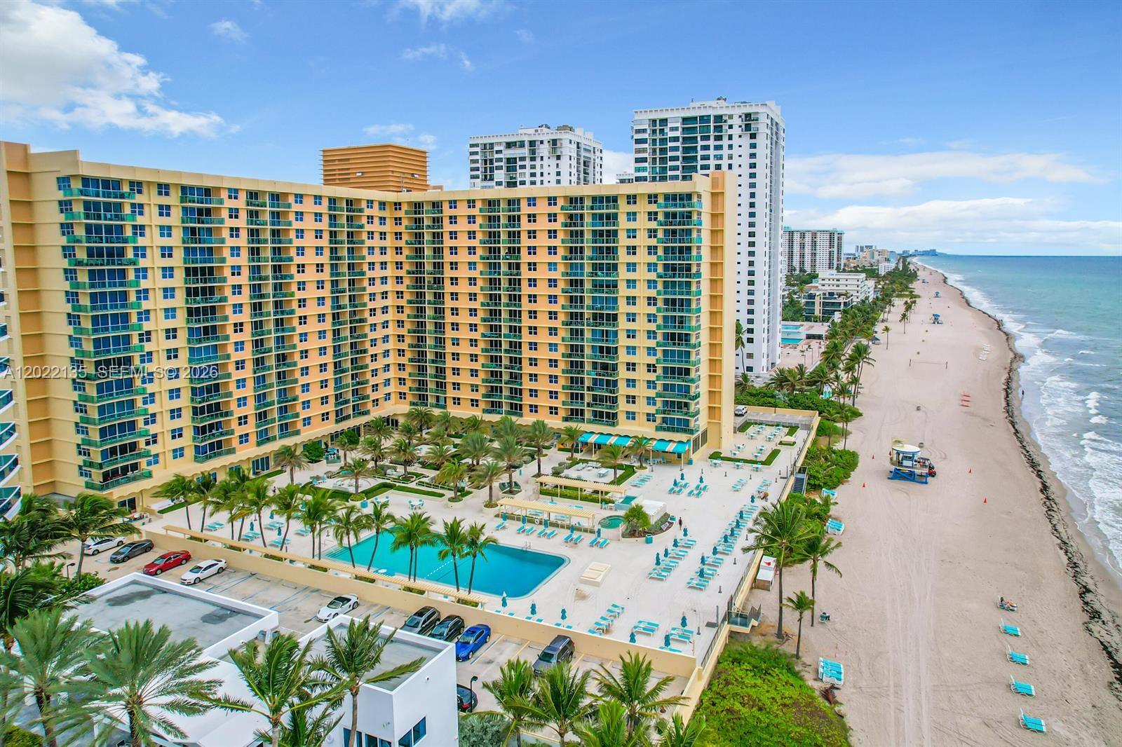 Luxury Beachfront Condominium with 1 bed room + 1 and 1/2 bathrooms. Laundry machine is in the kitchen area of apartment. New Dishwasher. Hurricane proof windows. View of Palm Trees. 1 Walking and 2 regular closets. Amenities include: Beach Service + Large Heated Swimming Pool + Jacuzzi + Professional Gym + Club Room with pool table. Maintenance (HOA) includes Water +Internet & Cable TV + central a/c. Building allows to rent 4 times a year for a minimum of 90 days or 1 year and longer and invite Guests 3 times a year for up to 21 days. 24 hours Reception+ Security & Valet. New Publix - Grocery Store across the road 3 minutes walk. Famous Hollywood Boardwalk is 10 minutes walking. 50 Years certification completed. Building completed renovation project 2 years ago. No Assessments / No Construction works. Beautiful Resort Style Living on the beach front in Hollywood, FL. Call /text Listing Agent