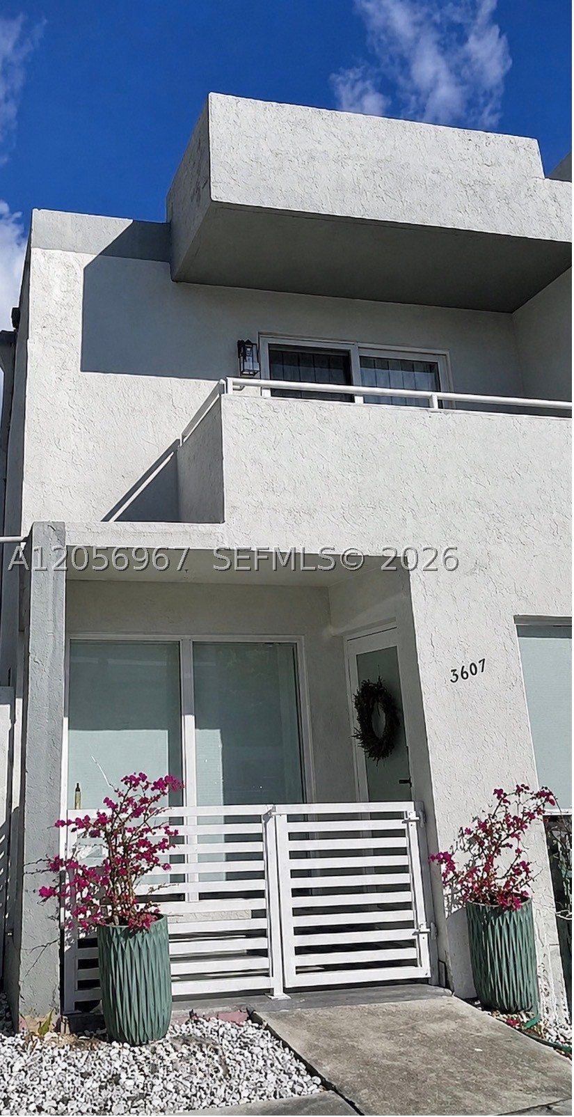 Welcome to Alhambra Manors a 16 Unit townhouse gated community located just steps from the Coral Gables business district, this beautifully updated townhouse offers an ideal opportunity for buyers seeking a low-maintenance home with the privacy and comfort of a completely remodeled townhouse near Coral Gables next to the Coral Gate Community - Owner has updated the townhouse beautifully with new impact windows / doors, custom closet cabinetry & doors, new washer dryer, kitchen appliances, fixtures, flooring , kitchen and baths and much more.  Low Condo fees are only $533 per month ( a lot less than most high rise condos)   and includes all exterior insurance and maintenance. Townhouse comes with 2 assigned parking spaces , a great outside private patio and 2 balconies ,a whole lot of character and wonderful location.  Don't miss this unique opportunity! Schedule your showing today!