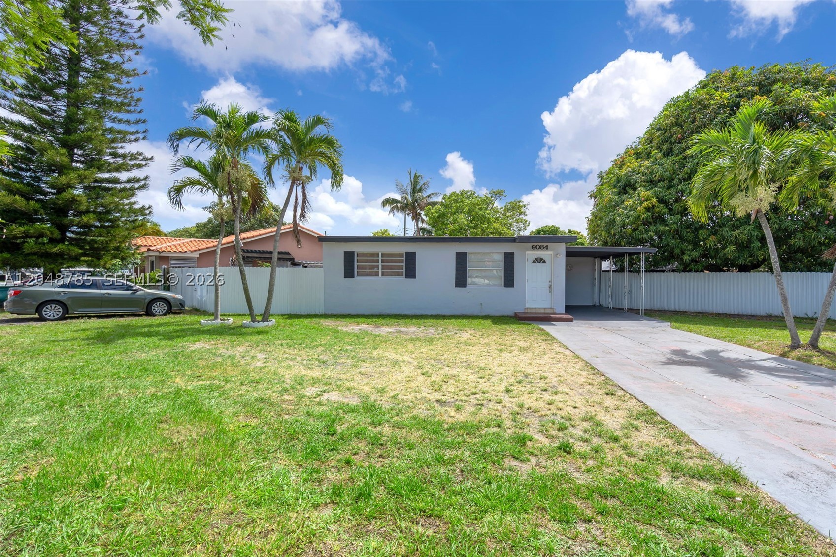 Welcome to this charming 2 bedroom, 1 bathroom single-family home situated on an oversized corner lot with 9,168 sq. ft. of space and endless potential. The property features a fully fenced yard with mature fruit trees, offering plenty of room for outdoor entertaining, gardening, parking, or future possibilities to expand and make it your own. Inside, the home offers a comfortable layout ready for your personal touch and vision. Conveniently located in an established Hialeah neighborhood, this is a great opportunity to create something truly special.