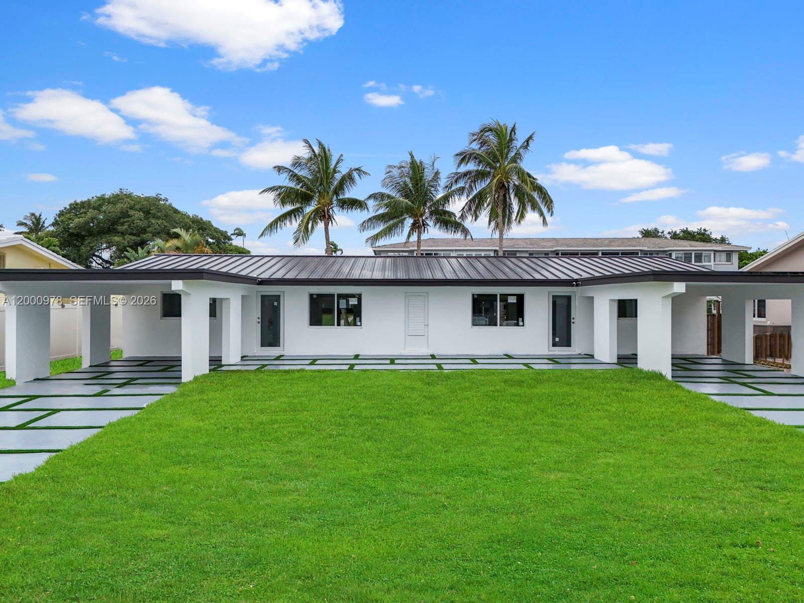 Experience exceptional coastal living with this one-of-a-kind waterfront duplex, offering a 3/1.5 and 1/1 split on 80 feet of prime water frontage with no fixed bridges. Meticulously reimagined from top to bottom, this complete spec rehab features brand-new electrical and plumbing systems, new impact windows and doors, a new aluminum roof, and new A/C units—delivering peace of mind and modern efficiency. Light-filled interiors and thoughtful upgrades create a seamless blend of style, comfort, and functionality, all in a location that embraces the best of South Florida’s boating lifestyle. Whether you plan to live in it or add it to your portfolio, this home delivers.