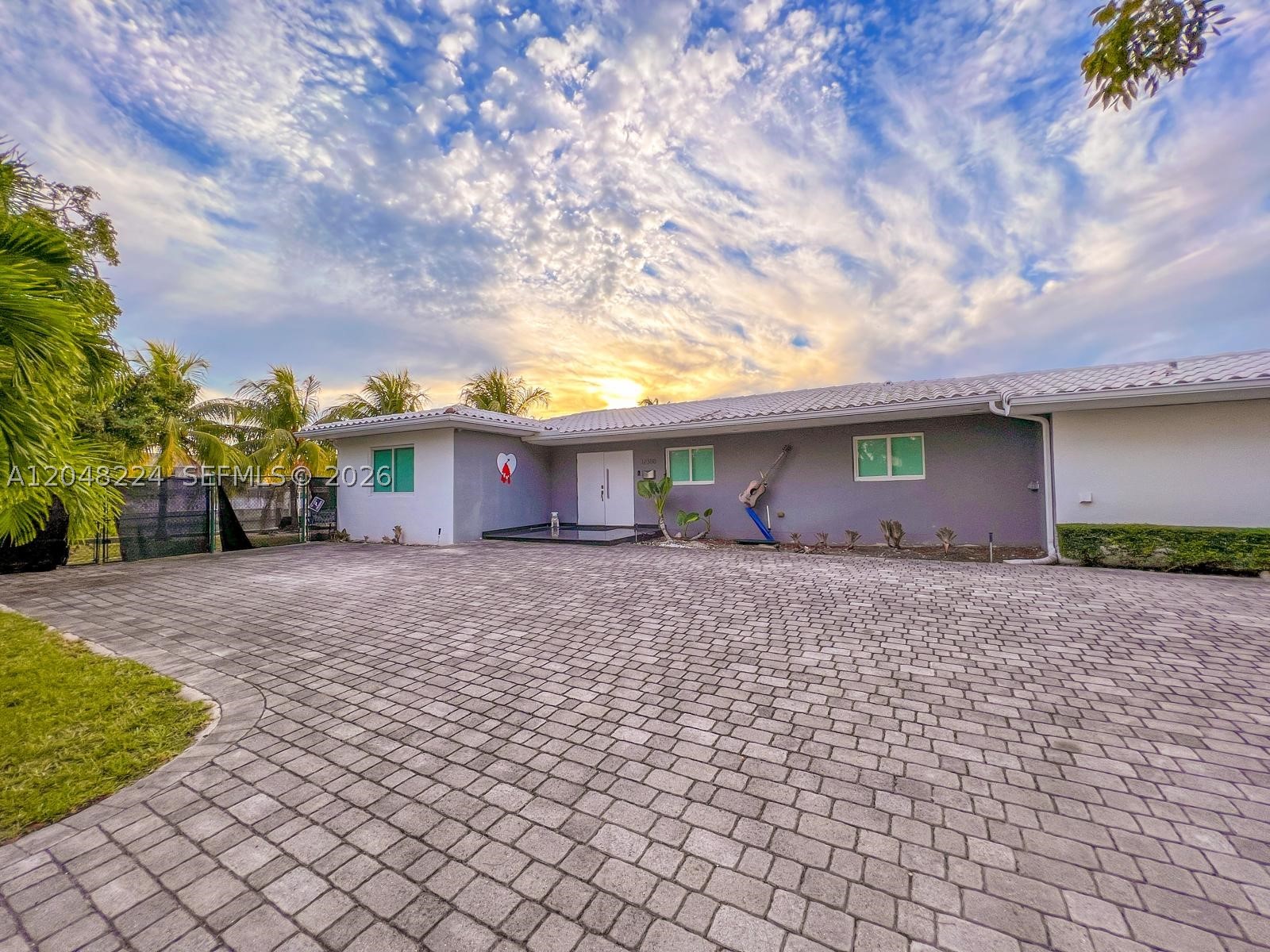 This contemporary 3-bedroom 2.5 bath  home. features floor-to-ceiling glass walls, a sleek open-concept kitchen with quartz countertops, and a private pool overlooking Biscayne Bay. The master suite includes a spa-like bath, and the landscaped backyard offers direct water access with a private dock. Property has one of largest lots to add this beautiful home. It has a marina that generates an additional income. It's close to all points.