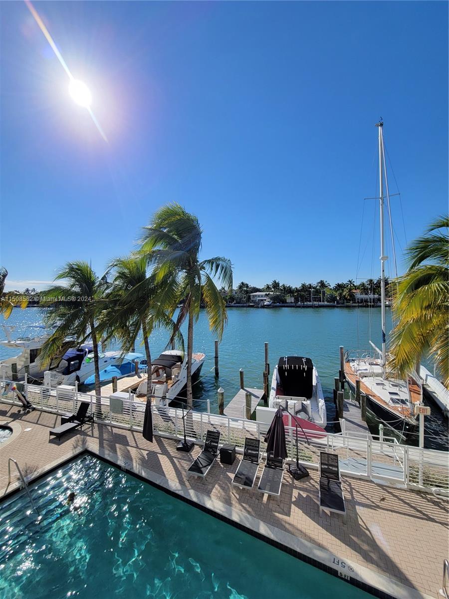 Fantastic 3Bed/2Bath corner rental directly over the peaceful intra coastal waterway overlooking private marina. This 1457 sf residence features wood floors, marble bathrooms, balcony, high ceilings and W/D. The Regatta is a boutique 52 unit building mid way between South Beach and Bal Harbour with concierge, gym, sauna, pool, whirlpool, private marina, a block and a half from the beach. Unit comes with two assigned parking spaces. Pet ok. Available immediately