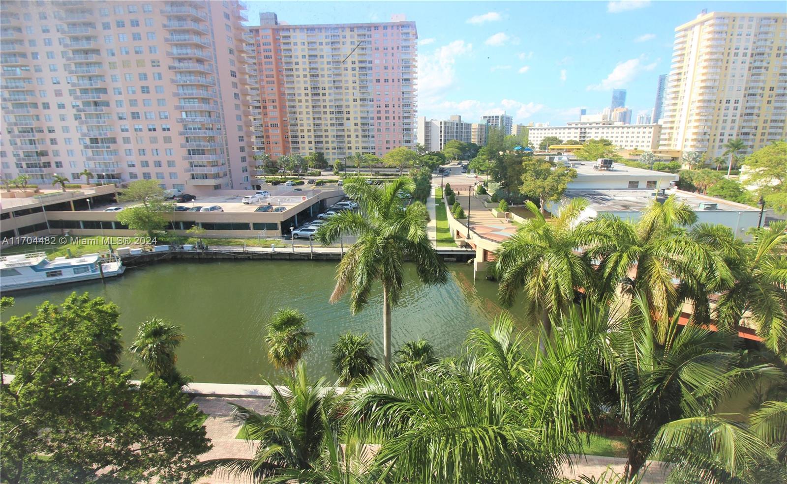 Tenant with 1yr lease ending 2/2027 is paying $3000/mo. Great for investor. Walk to the beach from this full 2/2 split bedroom condo in heart of Sunny Isles. 6th floor open great canal water views with privacy and ample light. Unit with laminate throughout. Kitchen with all stainless steel appliances. Full size washer and dryer inside. Enjoy two pools, clubhouse, BBQ area and a spectacular gym. Best Sunny Isles K-8 school. See broker remarks for special assessment