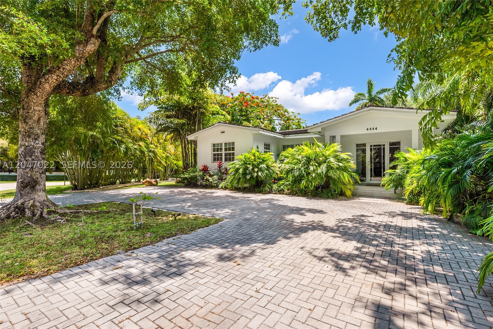 Bathed in natural light, this beautiful home blends timeless elegance with effortless indoor-outdoor living in the coveted enclave between Coconut Grove and Coral Gables. The open-concept design features 3 spacious ensuite bedrooms and a gourmet kitchen with marble countertops and top-of-the-line appliances. Set on an expansive 11,000+ SF corner lot with room for a pool, the home also offers a 2-car garage and an inviting deck for al fresco dining and entertaining. Just minutes from Coconut Grove's boutiques, restaurants, parks, marinas, and prestigious schools including Ransom Everglades, Carrollton, and Carver. A rare opportunity to enjoy the best of Miami living.