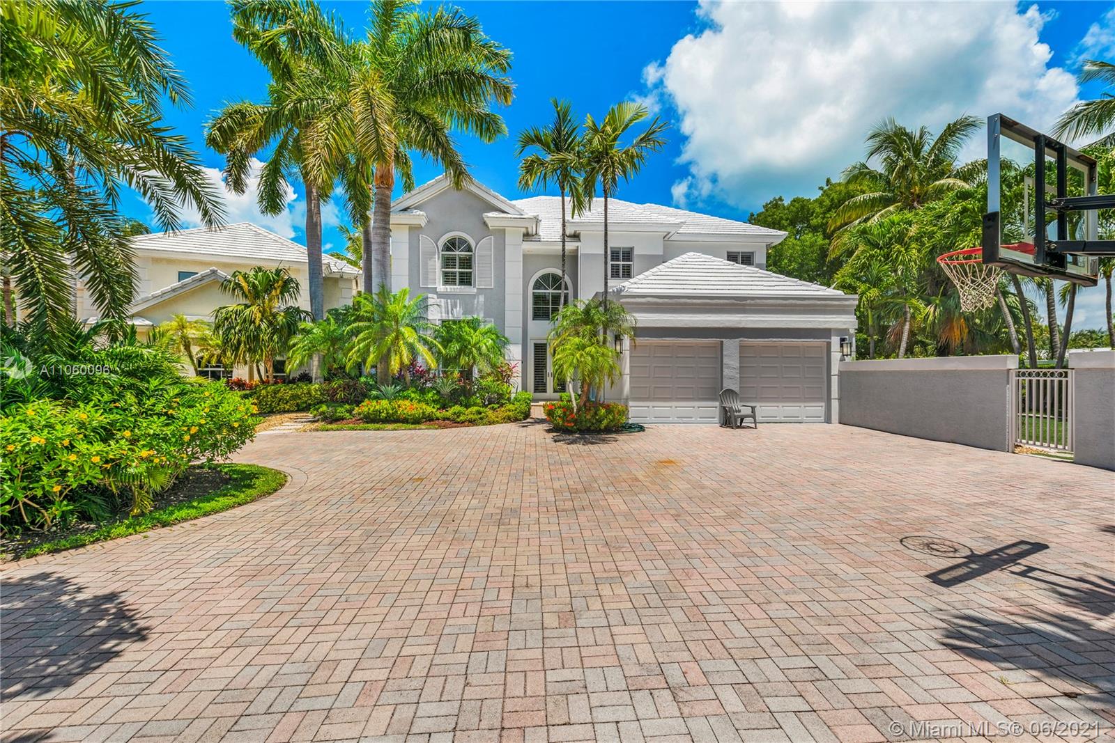 Gorgeous Grand Bay Estates Residence located on a very big corner with 10,809 Sq Ft of land.  Enjoy the Key Biscayne lifestyle within a private and gated community.  This fabulous home has been meticulously remodeled with the highest quality materials offering luxury, comfort and elegance with an incredible floor plan of 6 bedrooms, 5 bathrooms and impact windows and doors throughout.  With 4,225 Sq Ft under A/C …it is spacious, ample with very defined areas …living room, dining room, kitchen and family room, plantation shutters, 2 car garage and an amazing pool and patio area plus a wonderful yard for kids and/or pets.  Walk to the beach, the Ritz Carlton and shops.