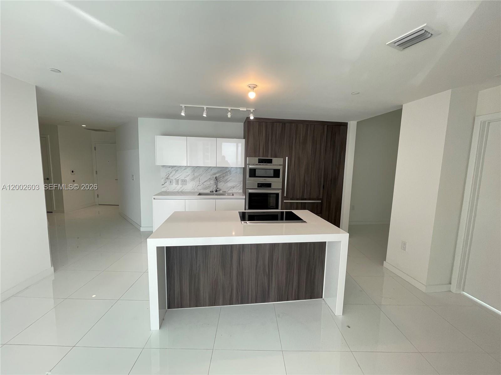 This stunning 2-bedroom, 3-bath luxury unit at Paramount Miami World Center offers an exceptional living experience. Featuring a private elevator, white ceramic floors throughout, and an oversized balcony with breathtaking sunset views of Miami, this home is truly one-of-a-kind. Enjoy built-out closets, blinds on all windows, and the convenience of 2 parking spots (1 valet & 1 assigned). The building boasts the world’s most amenities, including 5 pools, a spa, gym, basketball court, yoga studio, recording studio, racquetball, and more. With internet and cable included, this condo is perfect for both living and renting out. Don’t miss out on this incredible opportunity!----------UNIT RENTED TILL 1/31/2027, paying $6,700.00 PER MONTH - 24hs previous notice in advance at least to show