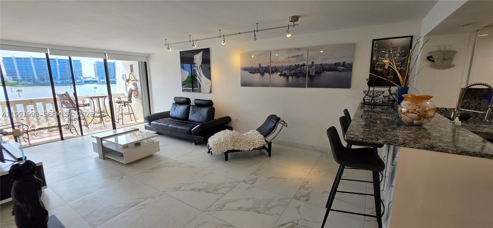 Welcome to this beautifully renovated 2-bedroom, 2-bathroom residence in the boutique-style Eden Roc Condominium, ideally located in the heart of Sunny Isles Beach. This spacious unit offers approximately 1,050 Sq.Ft. of living space and features tasteful upgrades throughout, including custom closet cabinetry, an updated kitchen, and remodeled bathrooms. Relax on your private lanai and enjoy tranquil Intracoastal and marina views with breathtaking sunsets.

Residents enjoy a peaceful waterfront setting while being just a short walk to the beach, as well as nearby restaurants, shopping, parks, houses of worship, and the highly rated Norman S. Edelcup K-8 School. The building offers a pool, sauna, BBQ area, boat dockage available for lease, and covered parking for up to two vehicles.

Whether you're looking for a primary residence, vacation getaway, or investment opportunity, this waterfront gem offers the perfect blend of location, comfort, and lifestyle in one of South Florida's most desirable beach communities.