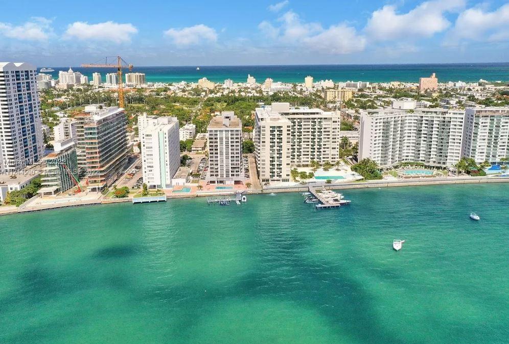 One of the few apartments in Miami Beach that has BOTH Ocean and Bay views. Watch the sunrise with an ocean view, watch the sunset with a Bay view. This 1/1.5 is located in the desirable West Ave area, near Lincoln Rd, the beach, Sunset Harbor, Venetian Islands and Whole Foods. Spacious bedroom, three closets and W/D. High impact windows with views of Downtown, Biscayne Bay and Miami Beach. Unit has polished marble floors and bathrooms, Wifi Philips color changing lights and Wifi A/C thermostat. Kitchen is equipped with stainless steel appliances, white cabinetry and granite stone countertops. Resort style living! 24 hour front desk attendant, secured building entrance, bike storage, full gym, covered parking, heated pool and dock. Internet, cable and water are included in HOA dues