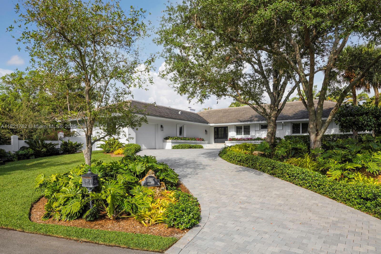 Welcome home to 11100 Paradela, an approximately 3,900 sq. ft. 5 bed, 5.5 bath home nestled on an oversized 26,500 sq. ft. cul de sac lot in gated Hammock Oaks. Gut renovated in 2020, every inch of the property has been thoughtfully transformed to create warm, stunning interiors evoking the California modern aesthetic. High vaulted ceilings, beautiful natural light, tasteful finishes + fittings, five en suite bedrooms and beautiful millwork throughout make this a rare offering in prime Coral Gables. Additional features include Control4 Home Automation, oversized garage with tons of storage closets, adjacent laundry room, custom lighting, covered terraces, a large backyard and a pool. Come see this dream home for yourself.