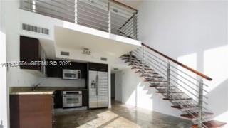 VACANT AND PRICED TO SELL - Beautiful corner two-story loft. Open floor plan on the second level. 2 private balconies. Extra-large built-in closet. Electrical and mechanical shades. Enclosed guest room and full bathroom downstairs. Washer and dryer in the unit. Spectacular views of the Miami River and Brickell Skyline. Wonderful amenities. Assigned parking spot on the 4th floor. Walking distance to Brickell City Centre, restaurants, shops, public transportation and more. Close to Bayside, Bayfront park, Miami Heat Arena, Downtown, Wynwood and 10 min away from south beach.