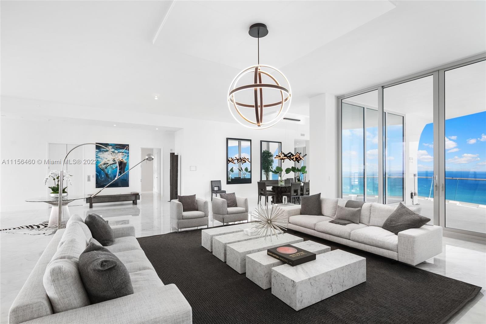 Introducing penthouse residence 5503 at Jade Signature— artfully realized without comparison or compromise by internationally renowned architecture firm Herzog & de Meuron. Enshrined atop the 55th floor, this palatial penthouse is perfectly attuned to its natural surroundings across 9,183 sq-ft. of flow-through interior space, offering unobstructed 360-degree direct ocean, Intracoastal and city views from each of its six bedrooms, seven and a half bathrooms, and 5,242 sq-ft., signature wraparound balcony. Raising expectations for appointed living, the residence is complete with multiple sitting and family areas, master office, study, library, playroom, breakfast + bar area, private gym, private pool & service quarters, making for a truly and distinctly personal refuge in the sky.